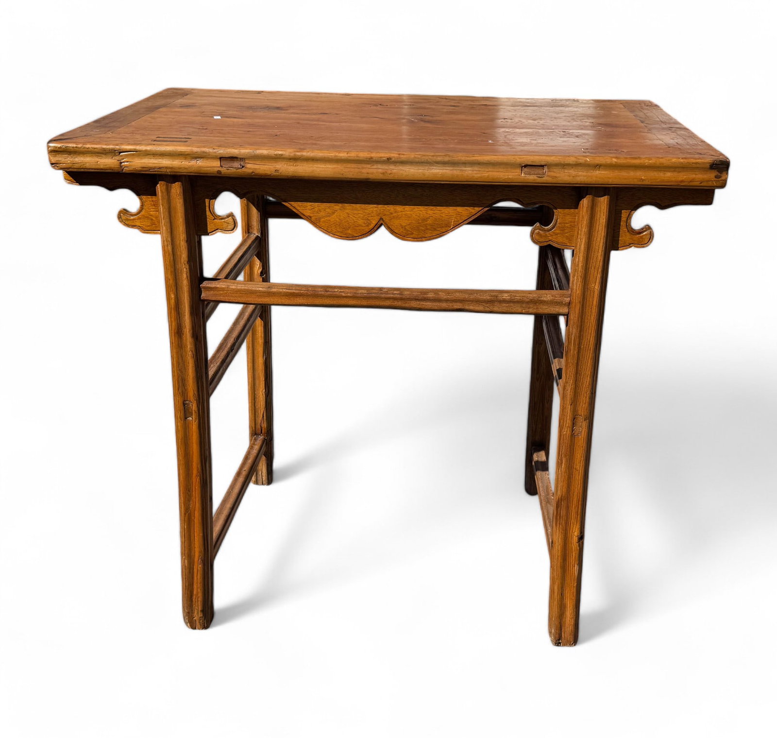 Chinese Tressel Table w/ Carved Skirt: Chinese trestle table w/ mortise & tenon joints. Item measures approx. 34" tall, 36" wide, & 23" deep. Decorative accent on skirt. ***Note: All furniture must be picked up or shipped within 5 business