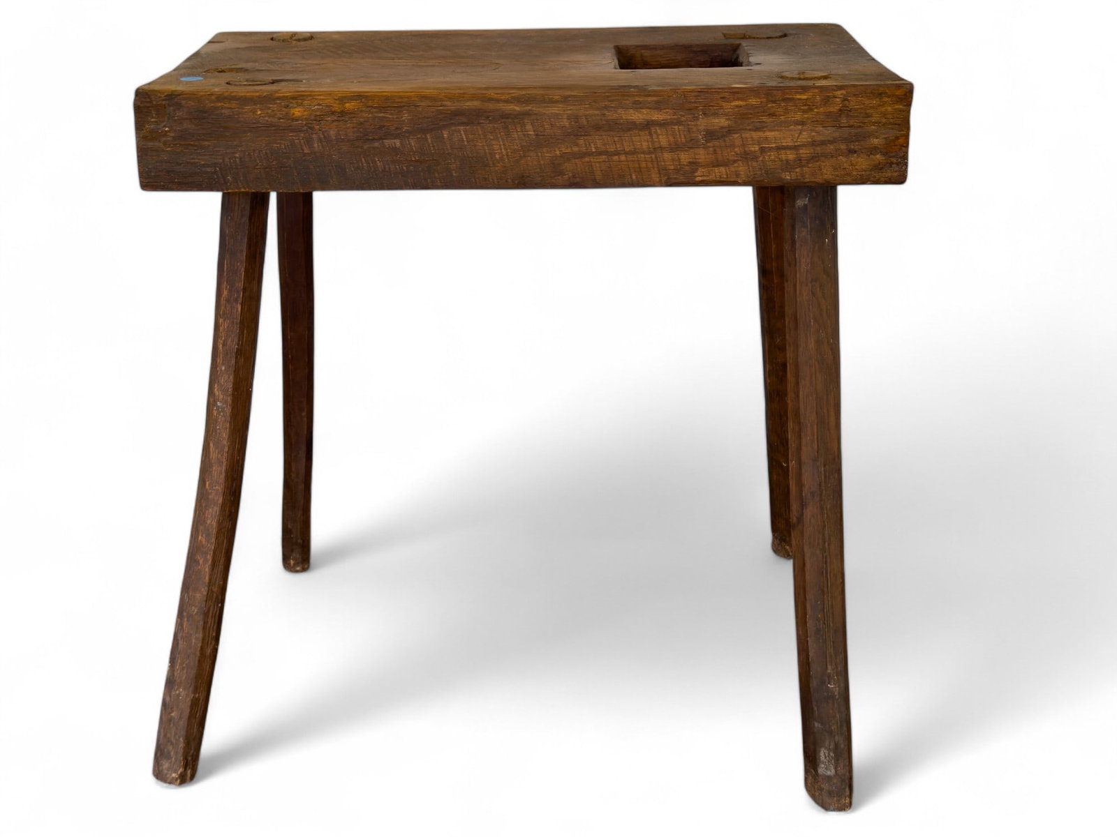 Splay Leg Butcher's Bench with Waste Hole: Splay leg butcher's bench with waste hole measuring approx. 26" H x 25.5" W x 14" D. ***Note: All furniture must be picked up or shipped within 5 business days of purchase. A $10 per day storage fee w