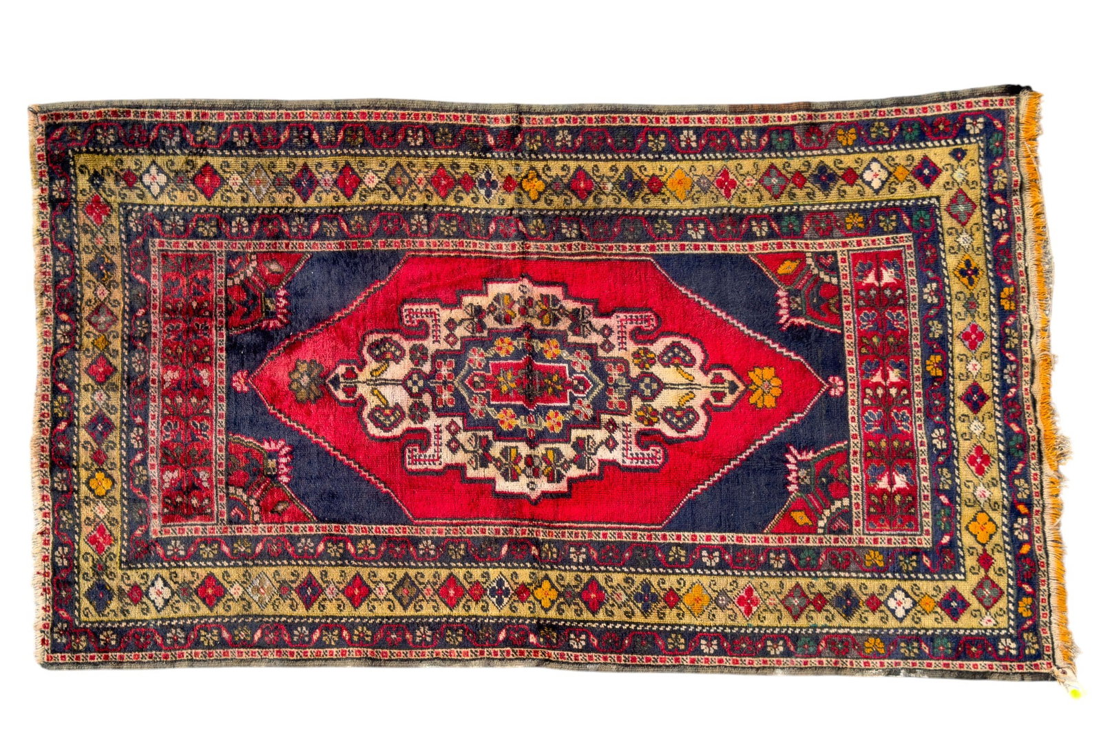 Hand-Made Vintage Turkish Rug: Hand-made Vintage Turkish rug, likely from Anatolia, approx. 4' x 6'10" w/ crimson, blue, green, yellow, orange, & cream patterns w/ geometric & floral / mushroom motifs. Some white paint stains along