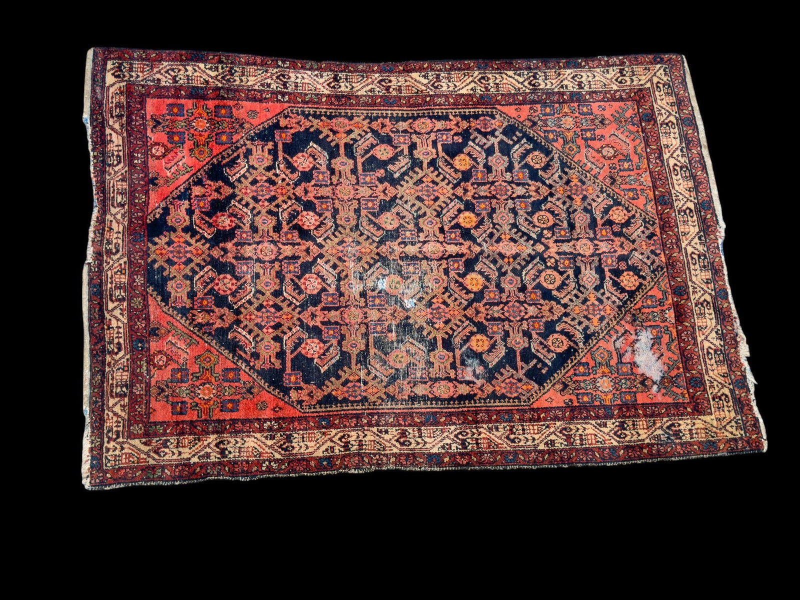 Vintage Persian Rug: Vintage hand-made Persian rug approx. 4'5" x 6'6" w/ red, reddish brown, tan, blue, orange, bluish gray, gray, & brown patterns w/ geometric & floral motifs. Some fringe loss & pile loss. *All rugs / 