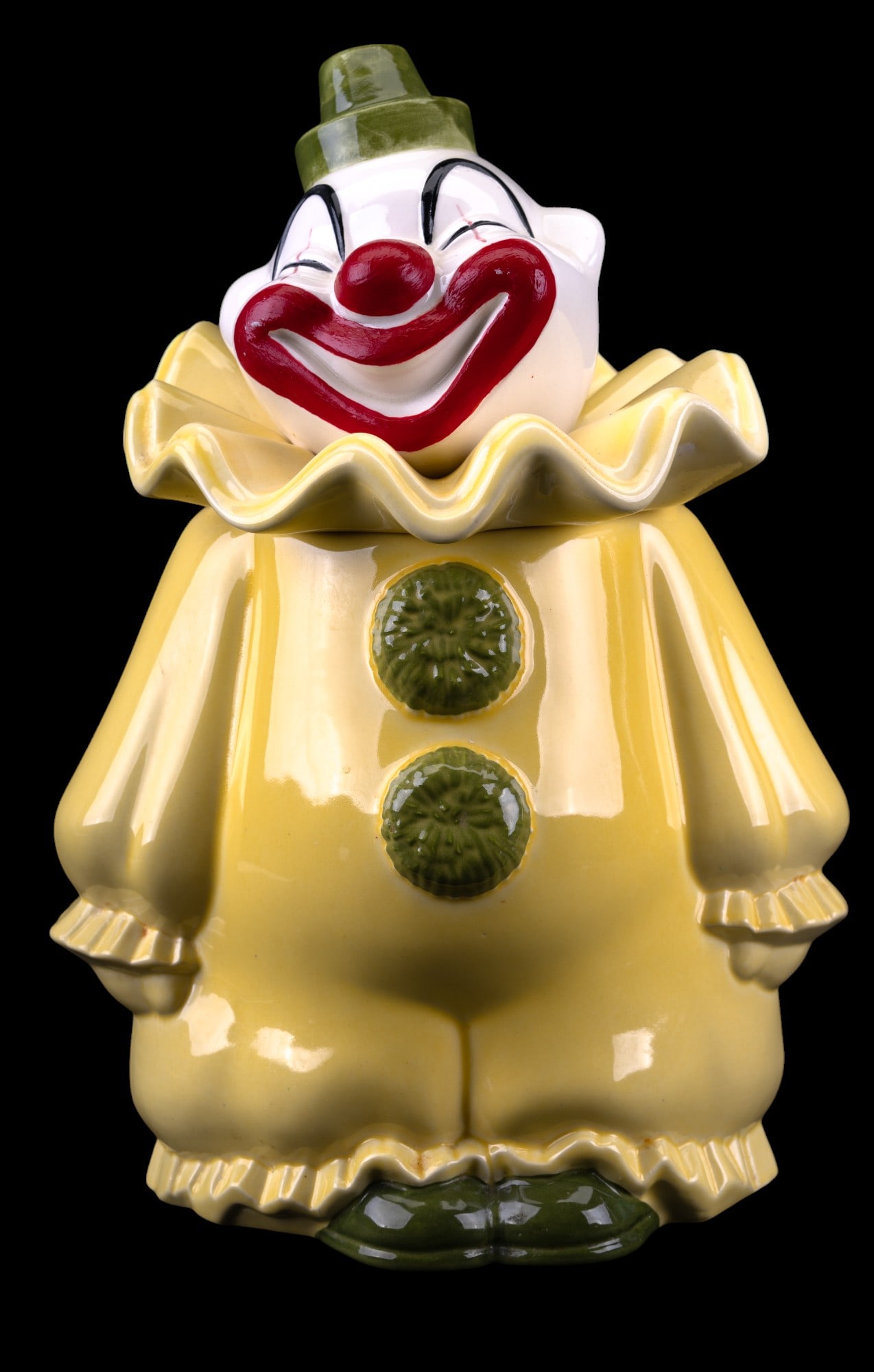 Vintage Metlox Poppytrail Clown Cookie Jar: Vintage Metlox Mfg. Co marked "Made in Calif. / Poppytrail" on bottom. Measures approx. 13" H and has minor paint loss on lip and hairline on bottom.