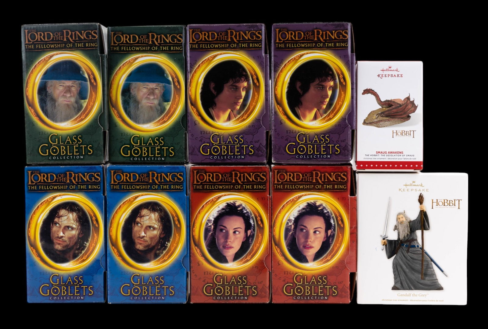 Lord of the Rings Movie Memorabilia: Quantity of eight Burger King commemorative promotional Lord of the Rings glass goblets in original boxes with light up bases still sealed in plastic, two of each character featuring Gandalf, Frodo, A