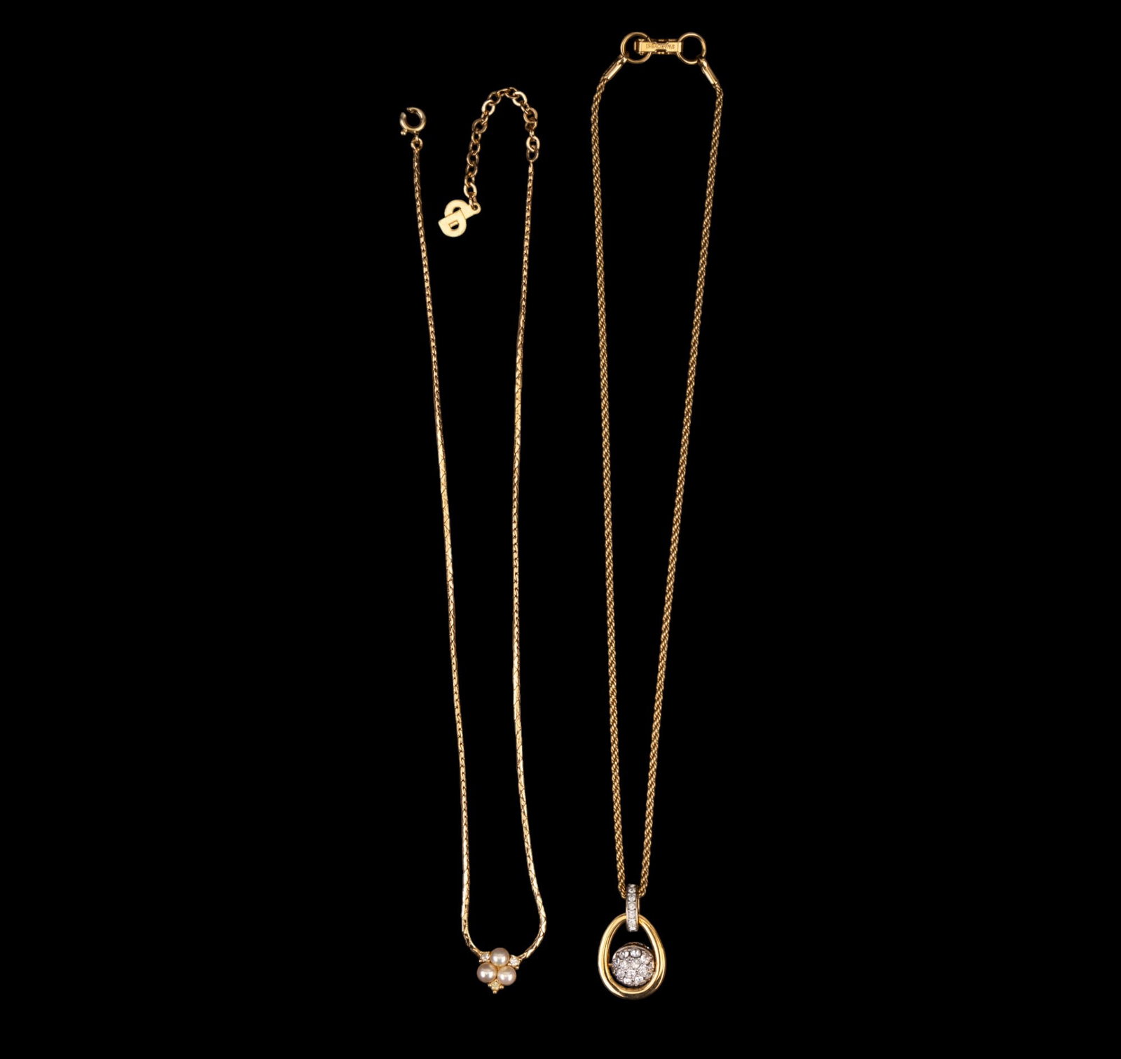 Swarovski and Dior Necklaces: Swarovski gold tone rope chain with crystal studded ball char and a Christian Dior gold tone necklace with pearl and rhinestone detail, note clasp needs repair.