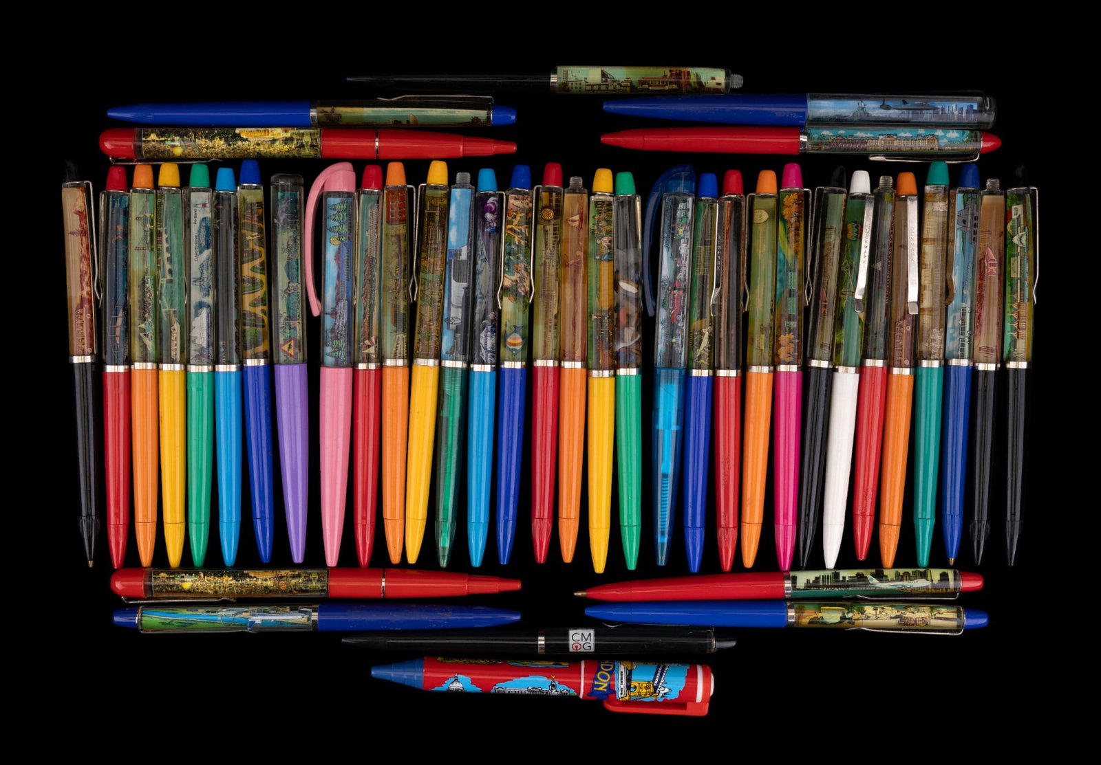 Vintage Souvenir Floating Pens (43): 43 assorted vintage souvenir pens from various destinations and most are floating pens with moving elements. Most are made in Denmark and marked in metal clips.