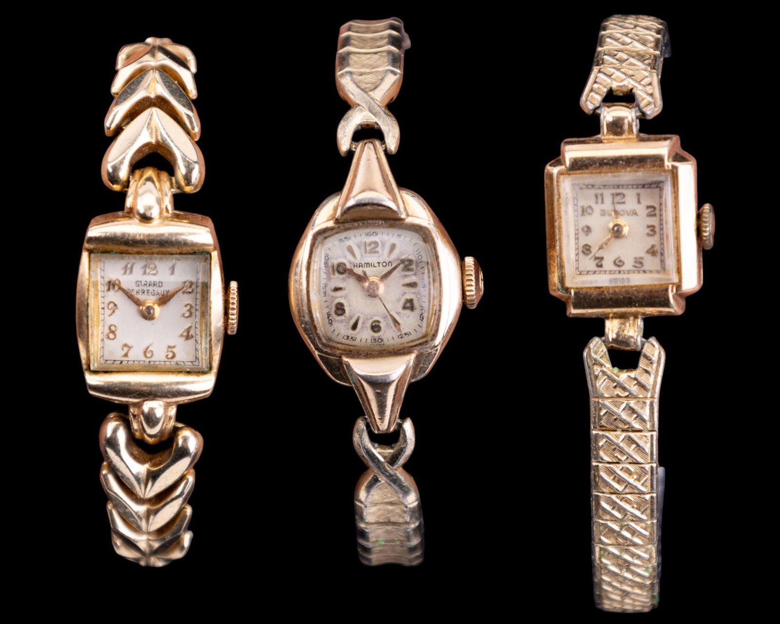 Gold Filled Ladies Wrist Watches: Three ladies wrist watches featuring Bulova 10k GF #H271242 on a Speidel band, Hamilton 10k GF bezel and steel back on a Speidel band, and Girard Perregaux 14k GF on a Speidel band.