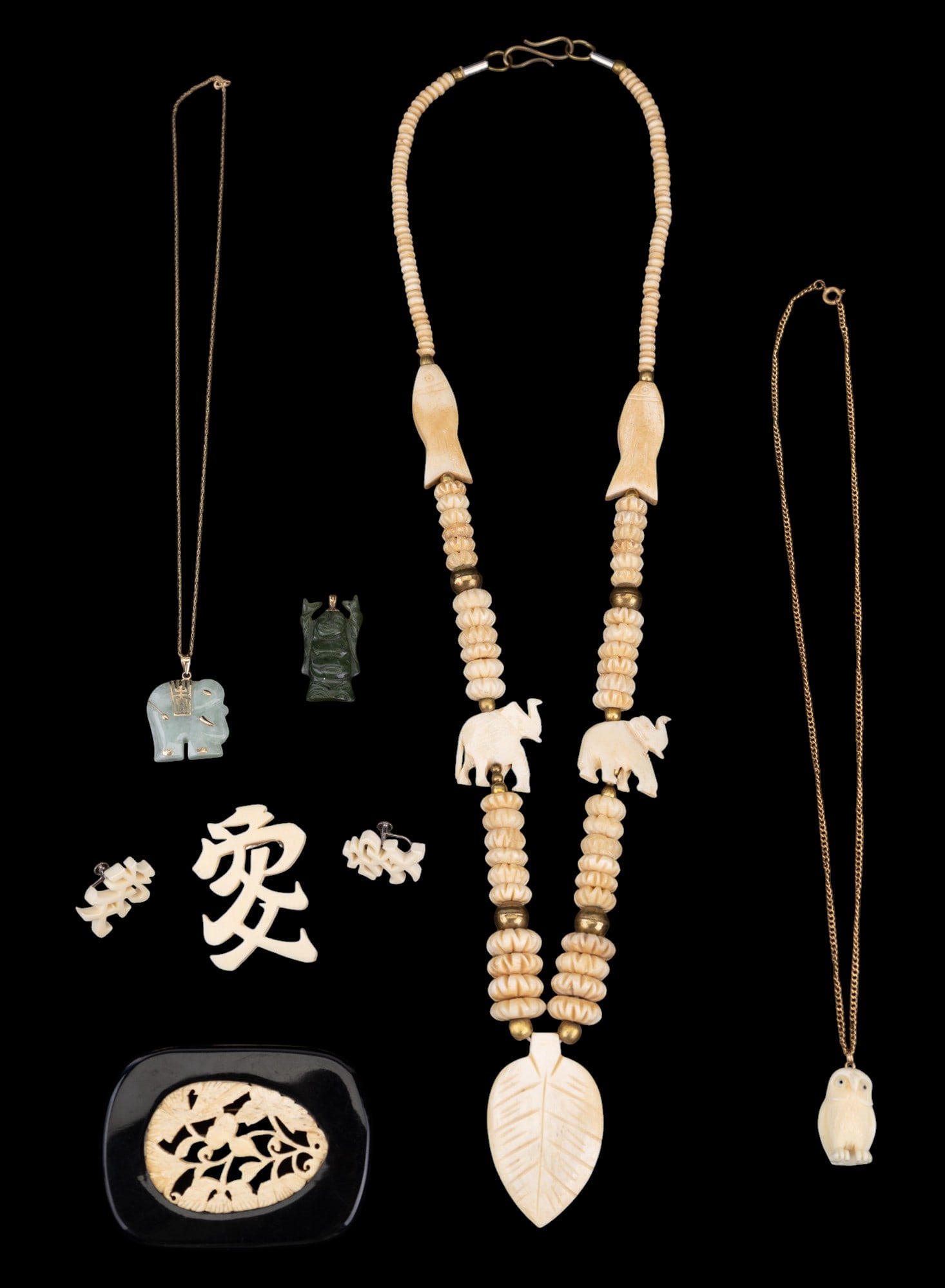 Green Hardstone 10K Gold Elephant + Bone Jewelry: Green hardstone (likely jade, not tested) & 10K gold elephant pendant w/ 10K gold chain necklace; green hardstone Budai the Laughing Buddha pendant; carved bone / natural material owl pendant necklace