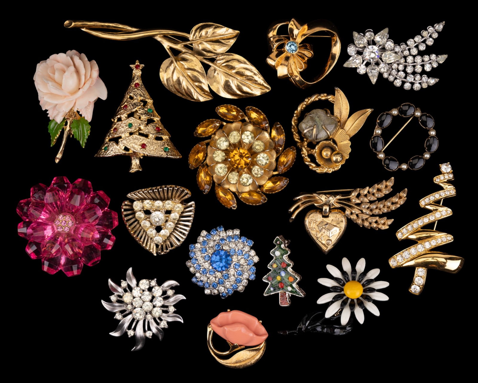 Floral and Holiday Brooches (17): Floral brooches by Avon, Trifari (1 for Betty Crocker), BSK, and more. 3 Christmas tree brooches and others.