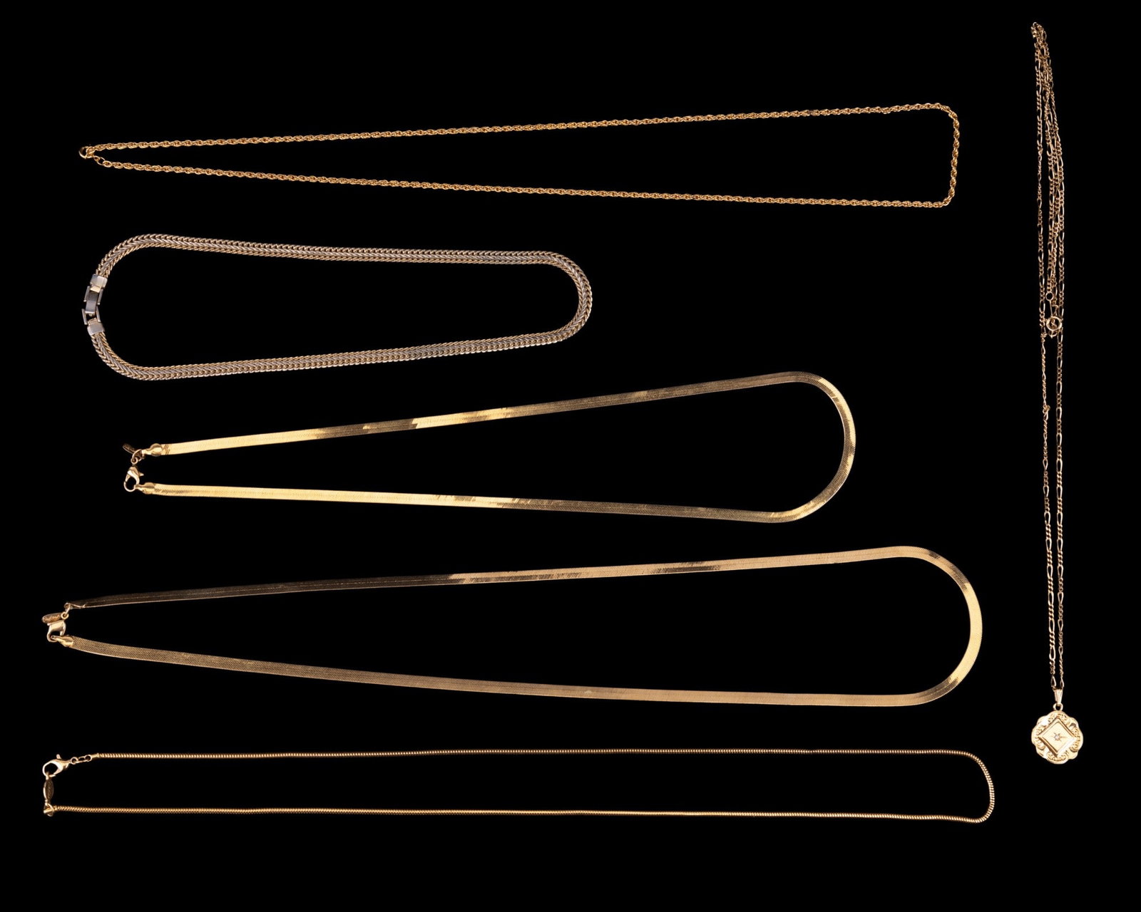 Gold Tone Fashion Necklaces: Two Napier flat braid chains 22" and 28", Napier snake chain 28", gold tone rope chain 28", raised flat braid gold tone chain 16", and a fabiano chain with gold pendant monogrammed on one side and rhi