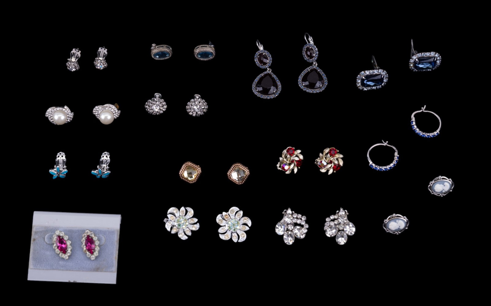 Designer Fashion Earrings: A collecton of clip on, screw back, and pierced earrings featuring designer brands such as Trifari, Sarah Coventry, Lisner, and a ATI BR CH earring set.