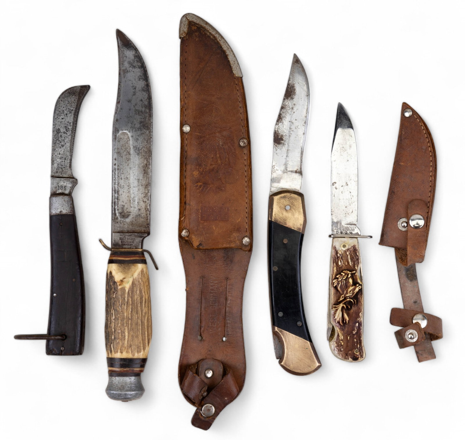 Edge Brand, Decora, Schrade Walden, & Other Knife: Edge Brand Solingen Germany 473 carved bone handle hunting knife w/ leather sheath, Decora Solingen Germany D.B.G.M fixed blade utility knife w/ 4 retractable tools & a carved bone hilt w/ elk head re
