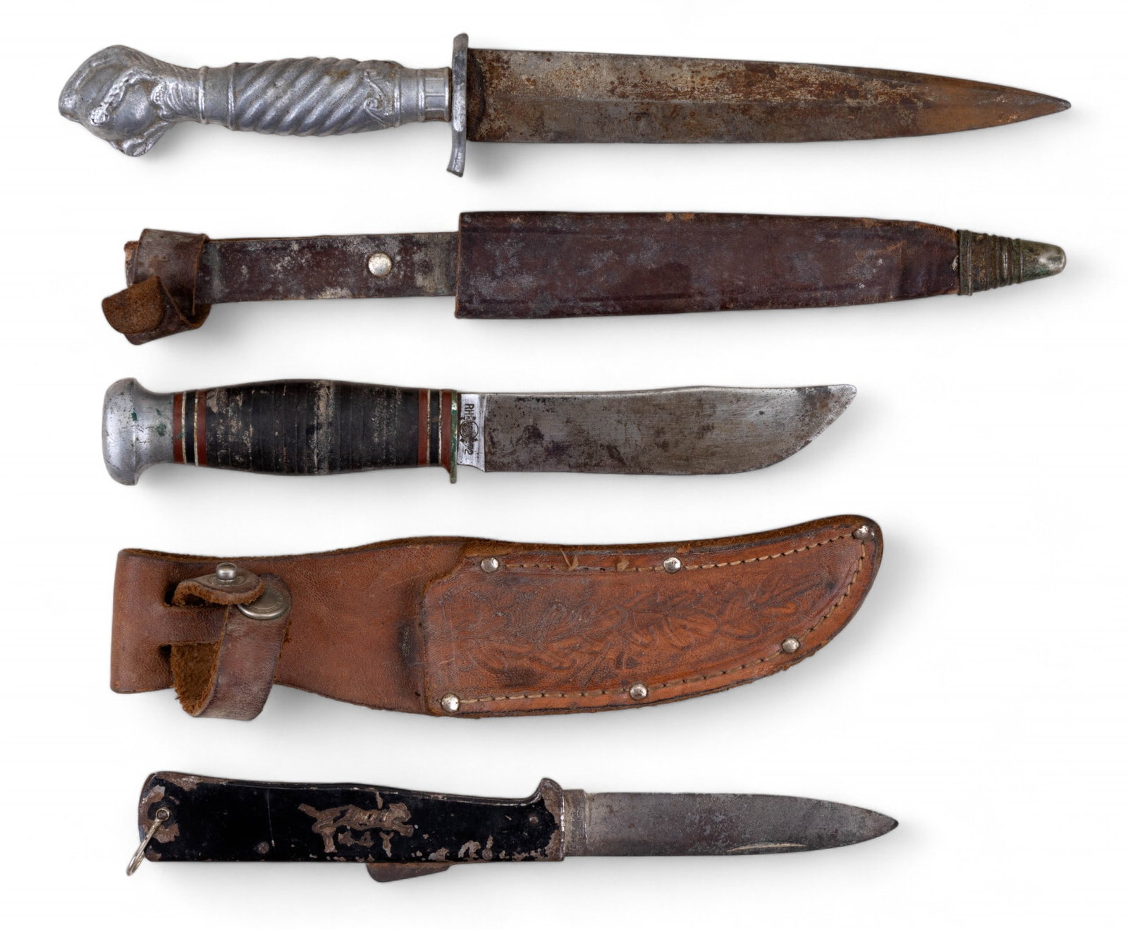 Remington RH72 Knife & Korium Solingen w/ Sheaths: Remington RH72 hunting knife w/ leather sheath, Korium forged Solingen steel dagger made in Germany w/ leather sheath, Japam Y44Y folding knife. Dagger measures approx. 10.25" long w/ a blade approx. 