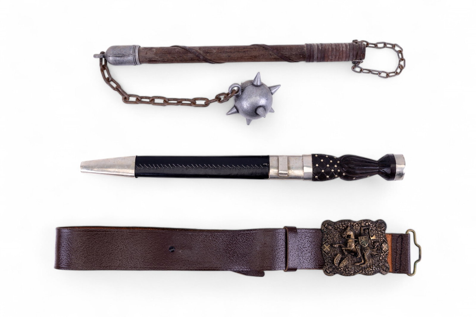 Scottish Dirk Dagger, Flail, & Don McKee Belt: Scottish Dirk dagger w/ wood handle & leather & metal scabbard, marked "India" at bottom of blade. One-handed flail reproduction w/ single spiked metal ball. Don McKee pewter kilt belt buckle w/ medie