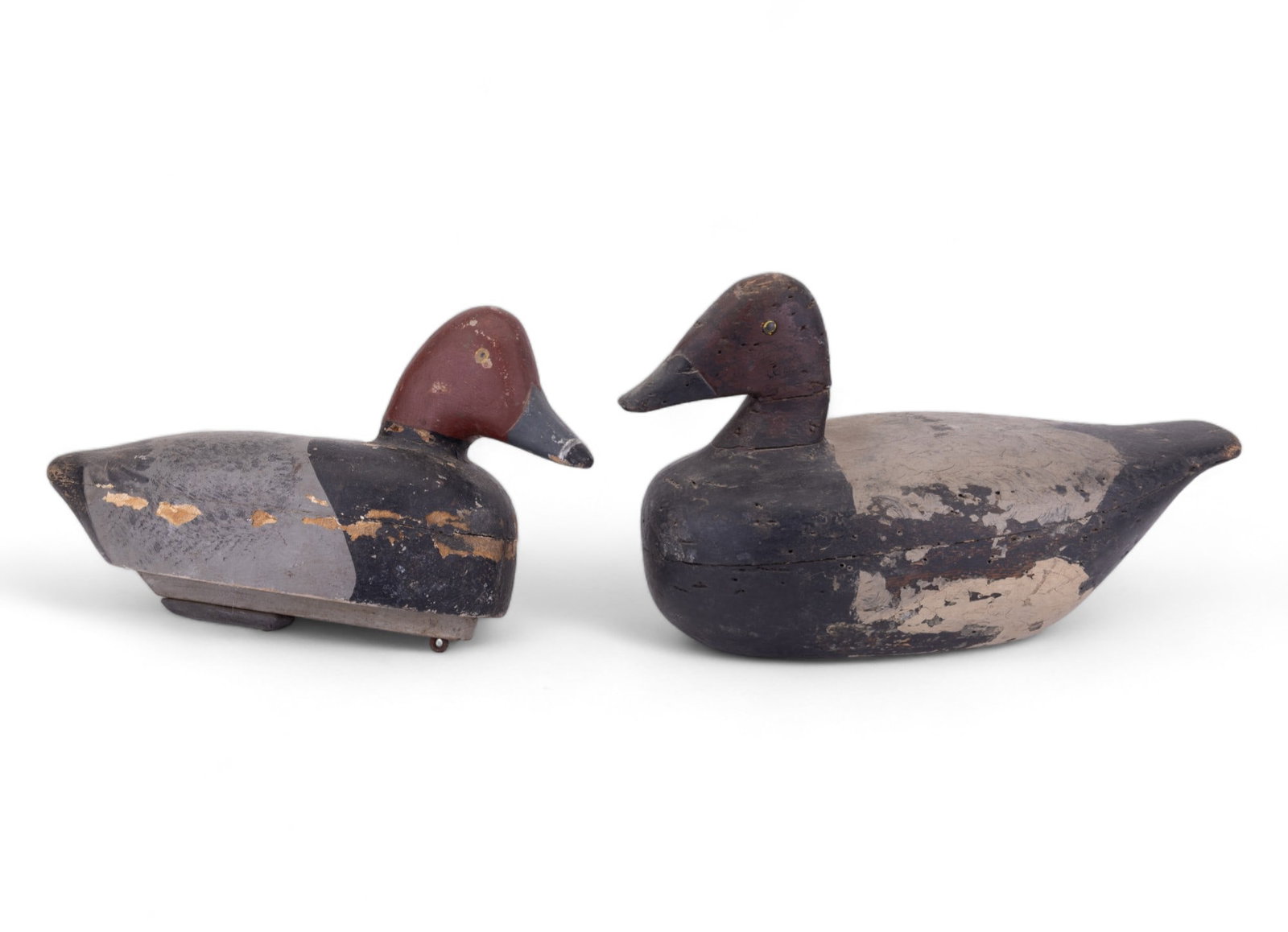 Circa 1930's Michigan Redhead Drake Decoys: Redhead Drake decoy w/ 3-piece construction & flat bottom. Item has 2-D painted eyes & original paint. Decoy measures approx 14.5"x5.5"x7.25". Other decoy is also a Redheaded Drake that measures appro