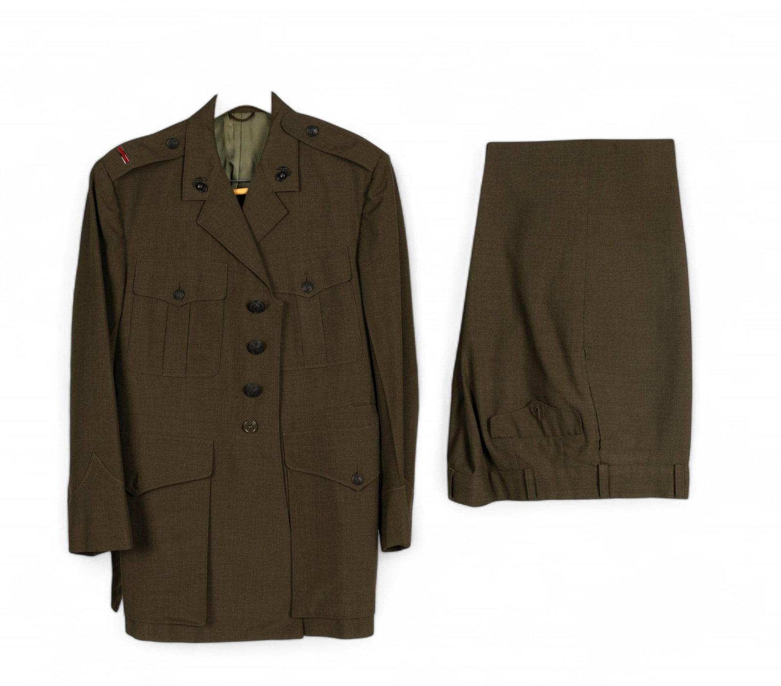 USMC Alpha Coat and Slacks: United States Marine Corps Alpha coat from Exchange Uniform Shop with 18" shoulder, matching slacks size 34x32, and cap. USMC Chief Warrant Officer and globe and anchor insignia on collar and cap.