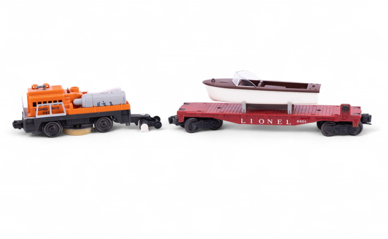 Lionel Postwar Track Cleaning Car & Flat w/ Boat: #3927 Track Cleaning Car with original bottles, repro pads, and box. #6801 flat car with repro boat - no box.