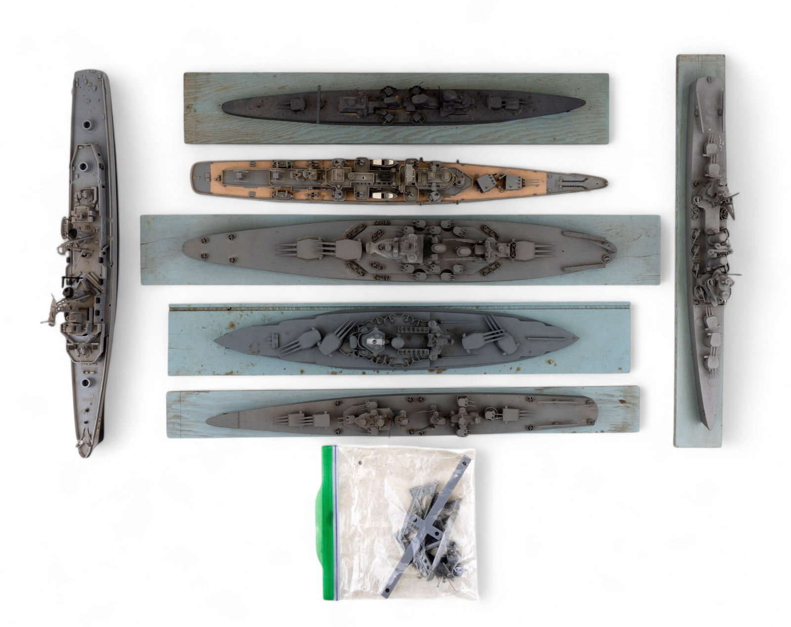 US and Japanese Navy Battleship Models (7): 4 assorted cast metal and wood model US Navy (USS New Mexico, USS Brooklyn, USS North Carolina, USS Baltimore) and 1 Japanese (Aoba) battleships mounted on blue wood bases - longest ship measures appr