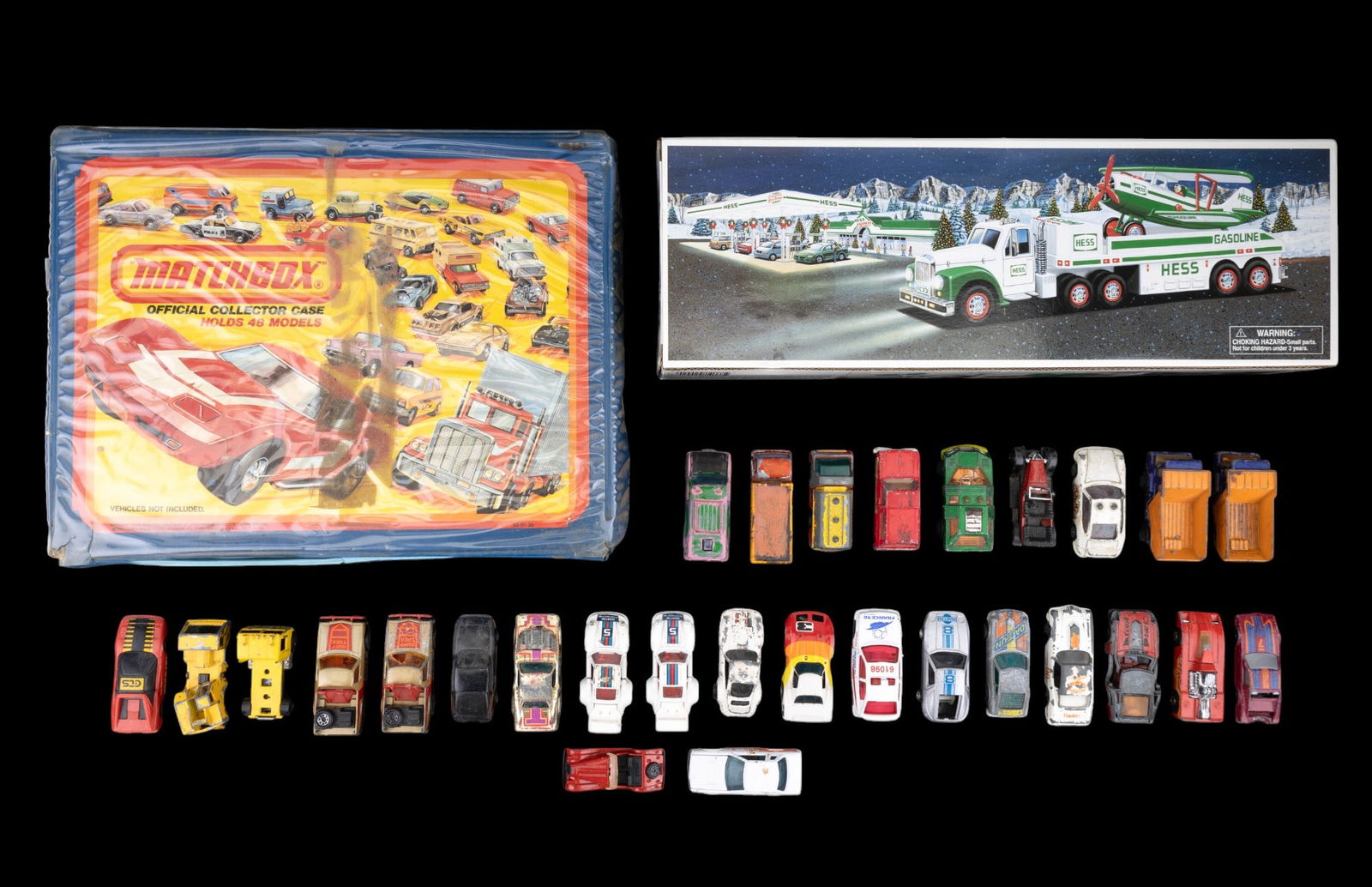 Matchbox, Hot Wheels, and Hess Collection: 77 assorted mostly Hot Wheels and Matchbox with some Ertl, Lesney, Kidco, Playart, Corgi, and Tomica in a range of wear and loss and some duplicate models; Includes 48 car carrying case with wear. 200