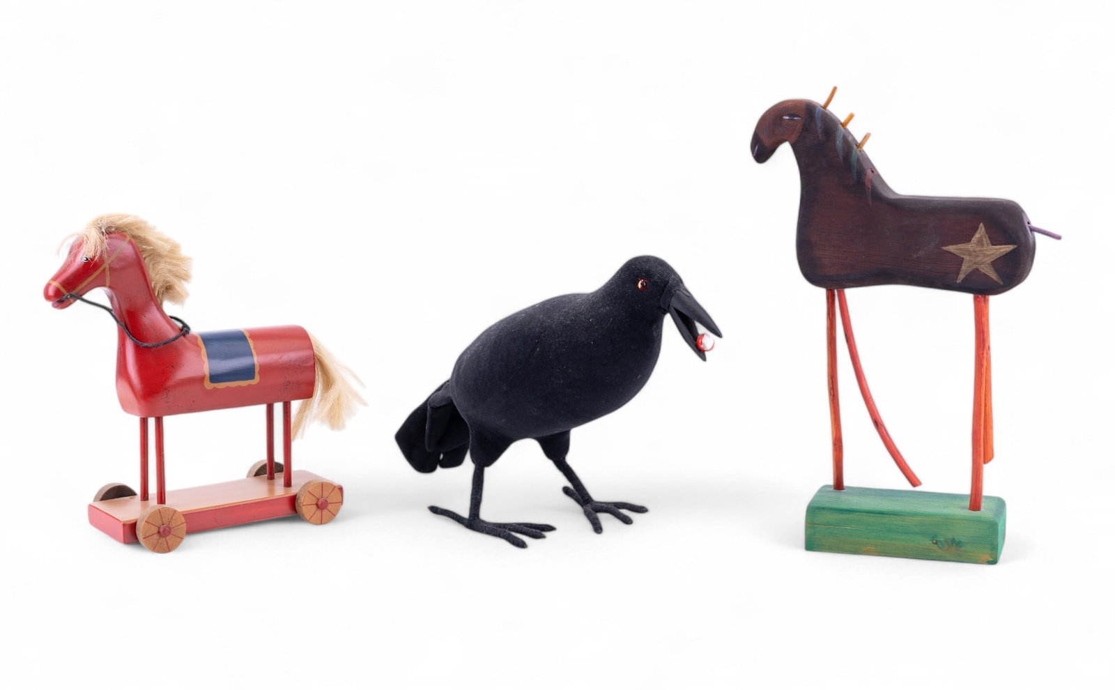 Wood Horses and Stuffed Crow Sculptures (4): Collection features a crow with a stuffed fabric body, cotton wrapped feet, and a wooden beak with red ball (with paint loss) measuring approx. 16" L x 9.5" H x 6" H, a hand crafted wooden toy rolling