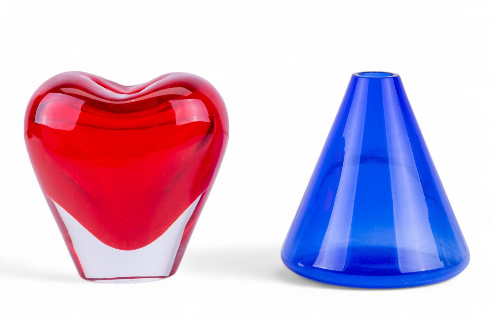 Salviati Murano Glass Vases (2): Blue Murano glass cone shaped vase dated 1997, 4x4" and a blown Murano glass red heart shaped vase dated 1998, 4x3x4.5", both signed Salviati on the bottom.