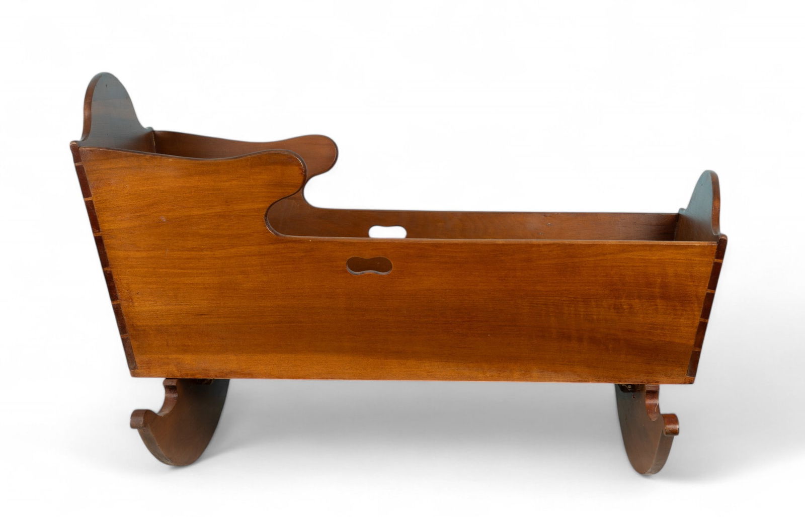 19th C Cradle w/ Dovetail Joints: 19th C wooden baby cradle that measures approx. 26" H at headboard, 18" wide body, & 39" long, rockers 29" W. Pegs and dovetail.