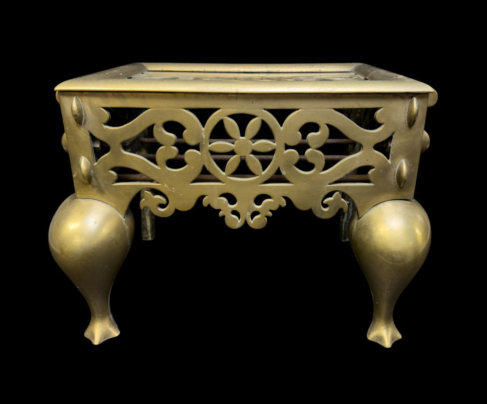 Antique 19th C. Brass Footman: Antique 19th C brass footman w/ floral design & ball feet. Item measures approx. 14" tall, 19" wide, & 14" deep. Some iron in construction w/ open fret work on front & top. Accented w/ 2 handles.