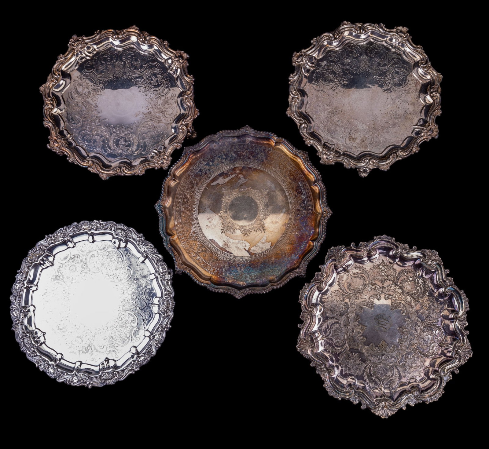 Victorian Silver Plate Footed Trays/Salvers (5): 5 total Victorian silver plate footed trays/salvers, one monogrammed in center. Each measures approx. 12.5" in diameter & stands approx. 1.25" high.