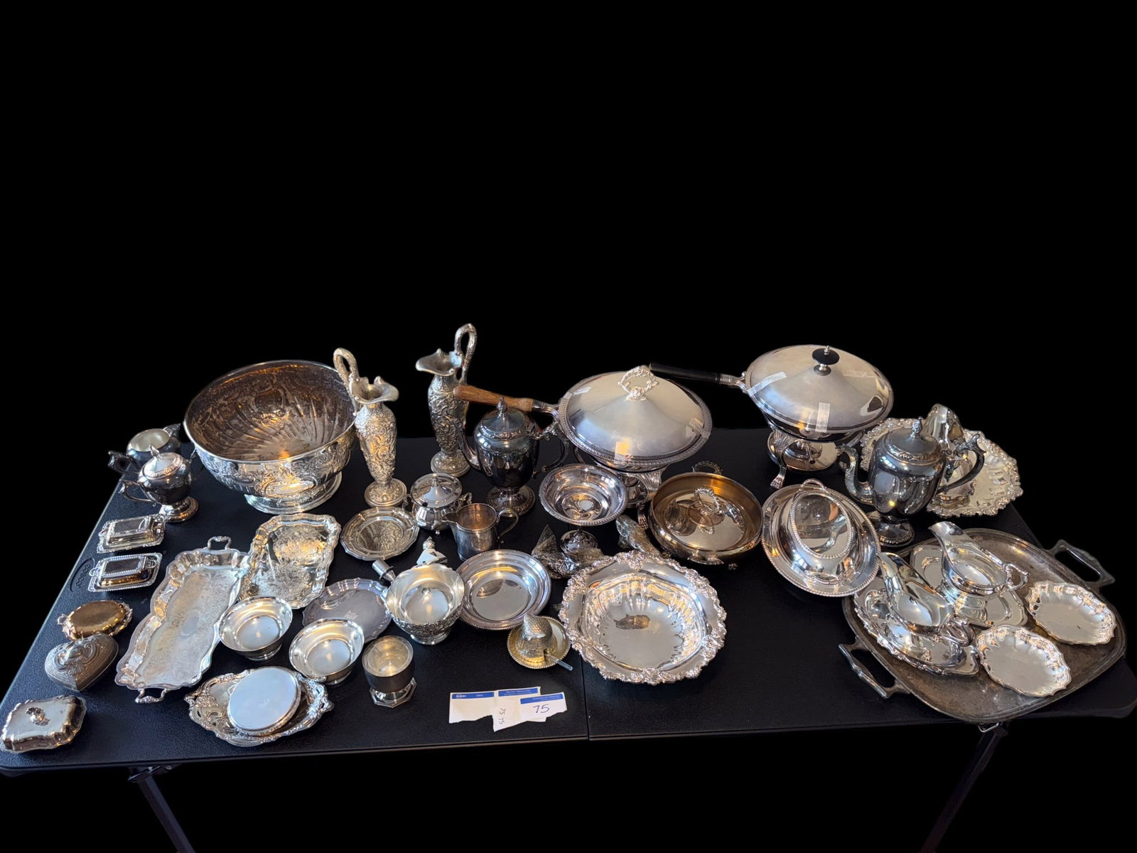 Approx. 40 Pieces of Silver Plate: Approx. 40 pieces of silver plate, including a punch bowl, chaffing dishes, creamers, coffee pots, & more. Chaffing dish measure approx. 13" tall, 12" in diameter, & 20" handle to body. See photos for