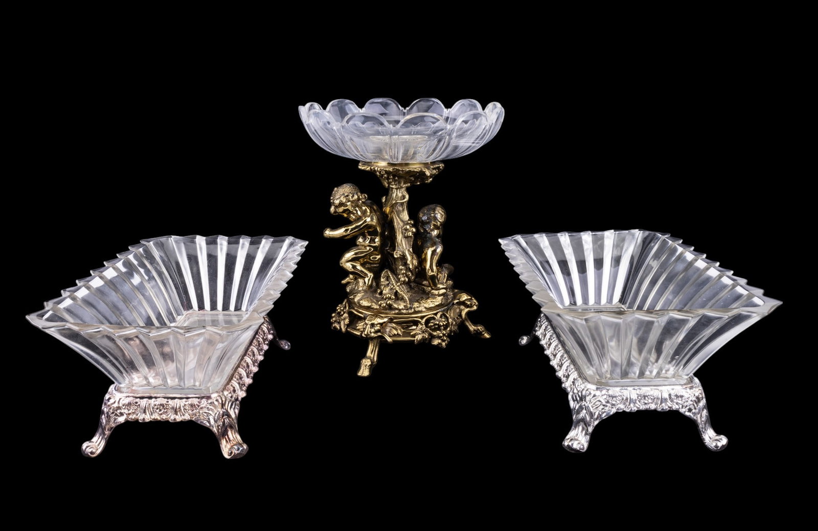 19th C Brass Figural Compote w/ Cut Glass Bowl: 19th C brass figural compote, cut glass bowl of compote is cracked. Compote is approx. 10.5" tall. Also included are F.B. Rogers footed glass & silver plate vessels. One Rogers vessel has a hairline c