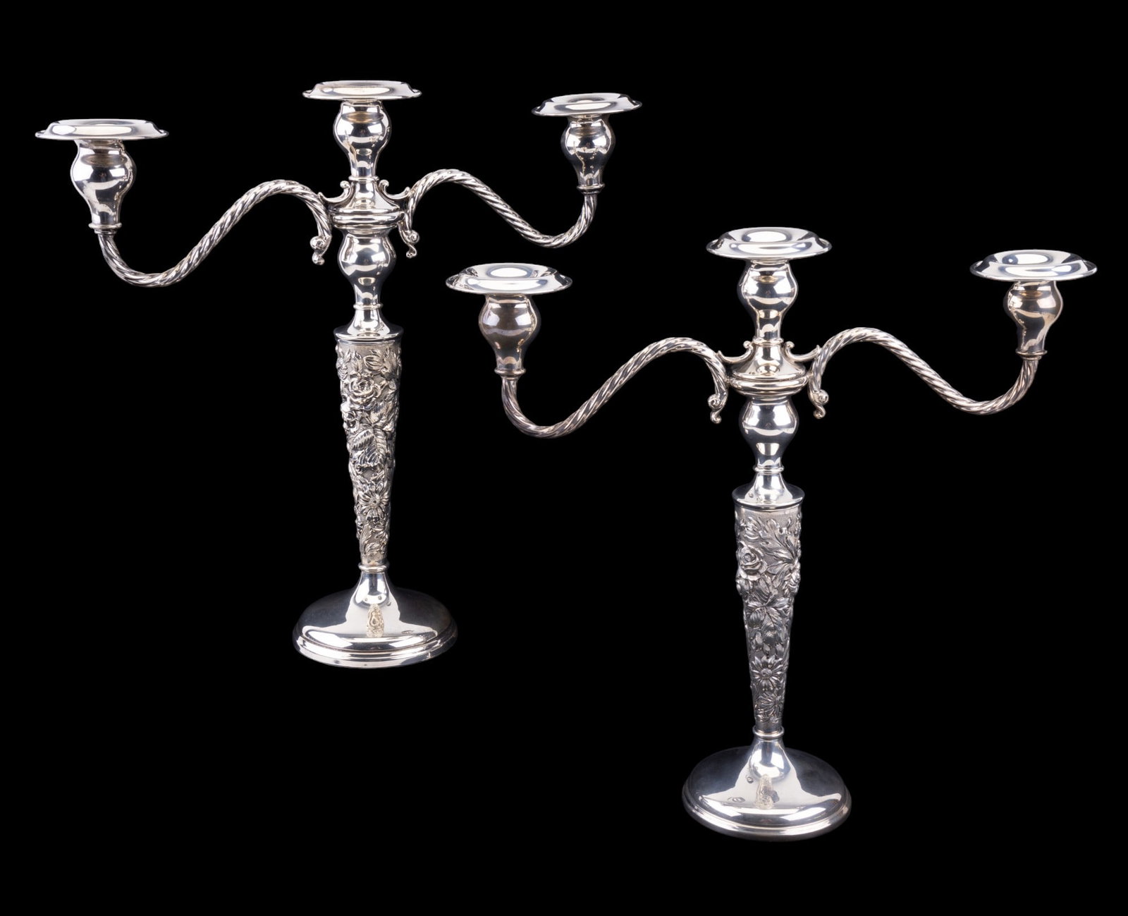 Stieff Weighted Candelabras: Stieff weighted candelabras approx. 13" H x 14" W. Items have ornate floral relief detailing. Bottom reads ?Stieff Sterling Cement Filled Hand Chased 159".
