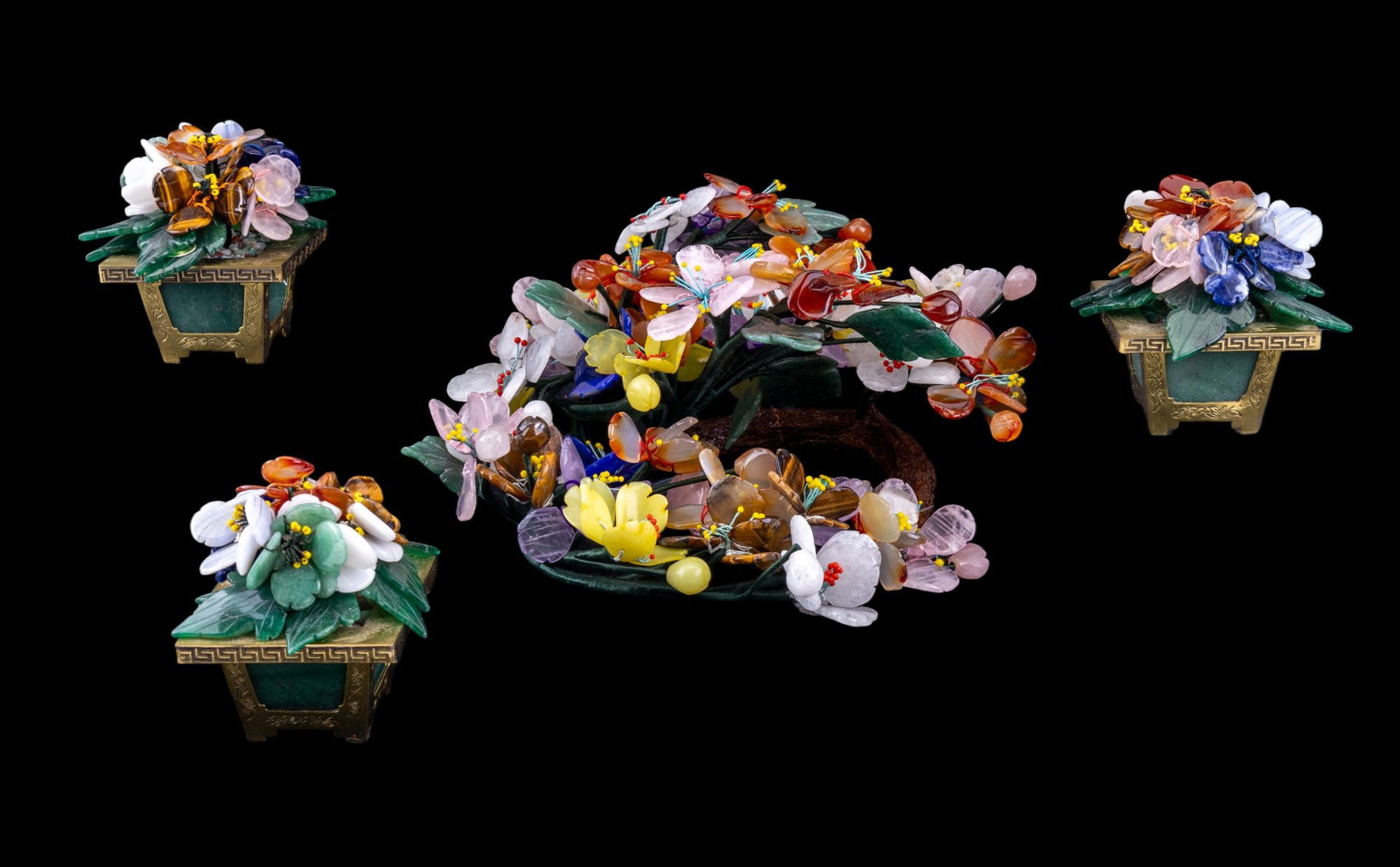Jade Tree Centerpiece, 3 Smaller Jade Trees: Circular jade tree centerpiece w/ floral motifs & 3 matching jade tree accent pieces. Centerpiece is constructed of real stone leaf & pedal accents. Smaller 3 trees have brass, stone-paneled pots & re