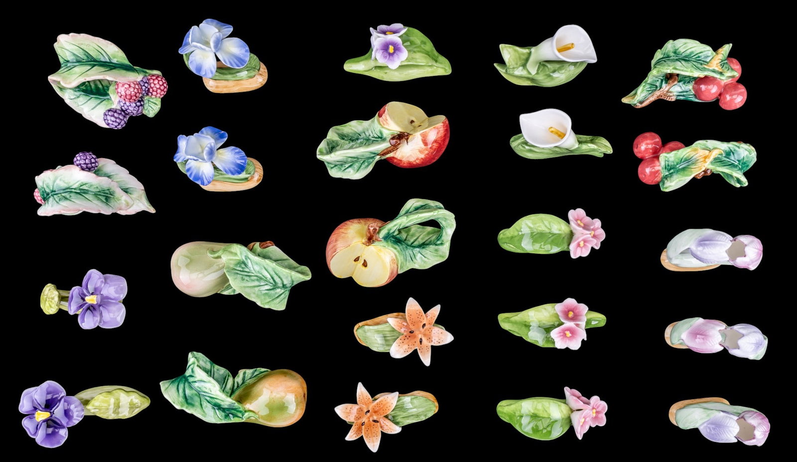 RPA & RCPC Porcelain Napkin Rings (23 Pcs): 23 total RPA & RCPC porcelain/pottery napkin rings w/ leaf, floral, & fruit patterns. Largest measures approx. 4" x 3" x 2". See photos for further details.