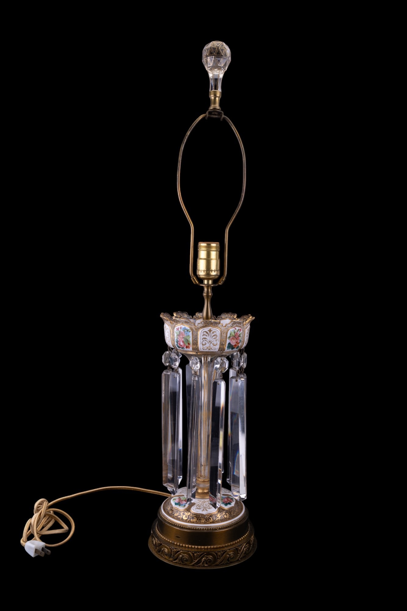 19th C Moser Bohemian Glass Lamp: Moser Bohemian enameled white to clear cut glass lamp w/ gilded highlights. Lamp has heavy lusters, enameled floral motifs, & could potentially use a new cord. Lamp is approx. 30" tall to top of finia