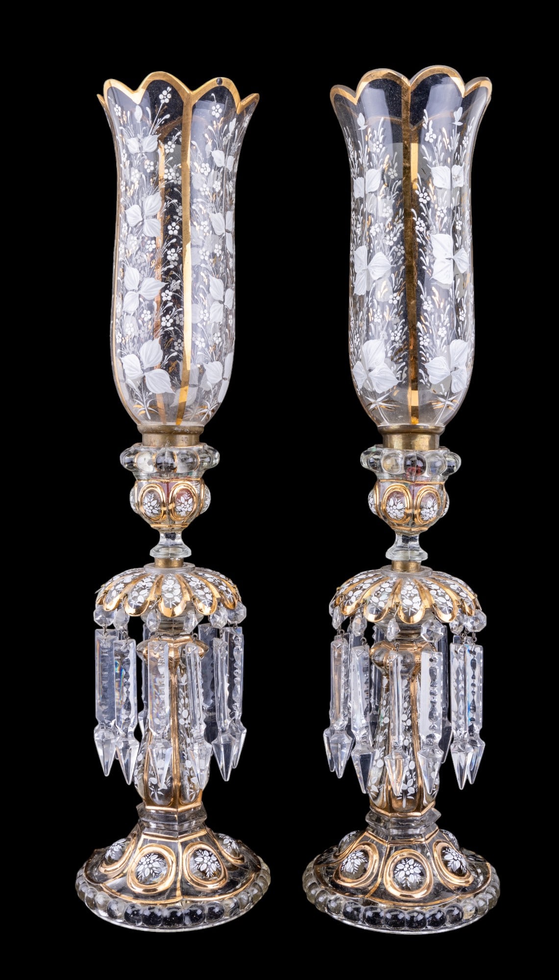 Pair Moser Bohemian Glass Candle Sticks: Pair of Moser Bohemian glass candlesticks w/ etched hurricane shades & hanging crystals. One hurricane shades has a flea bite on top rim. Items measure approx. 23" tall to top of hurricane shades.