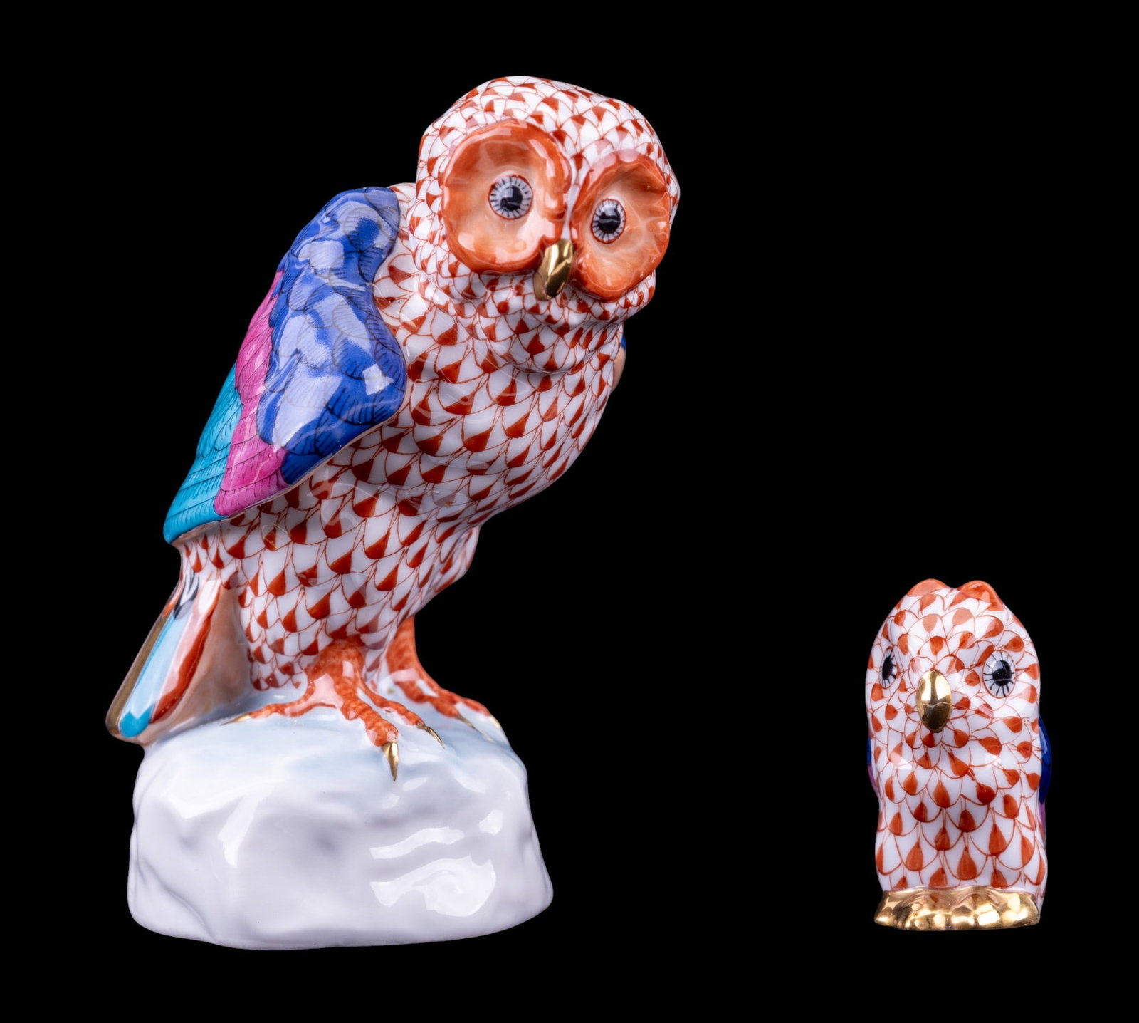 2 Herend Porcelain Owls: 2 Herend porcelain owl figurines w/ pastel colors, the larger measuring approx. 4.35" tall, 3" wide, & 3.5" deep.