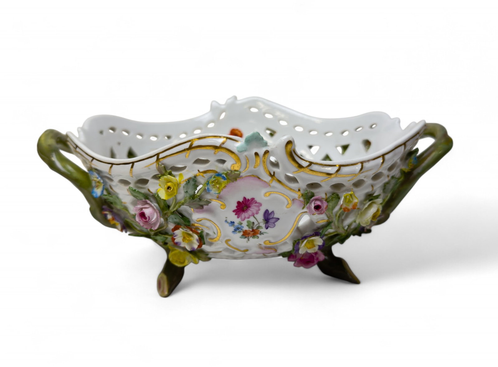 Meissen Pierced Floral Bowl: Meissen pierced porcelain handled floral bowl w/ minor loss to flower pedals. Design features bright spring colors. Approx 4" x 10" x 7.5" some minor loss to flowers.