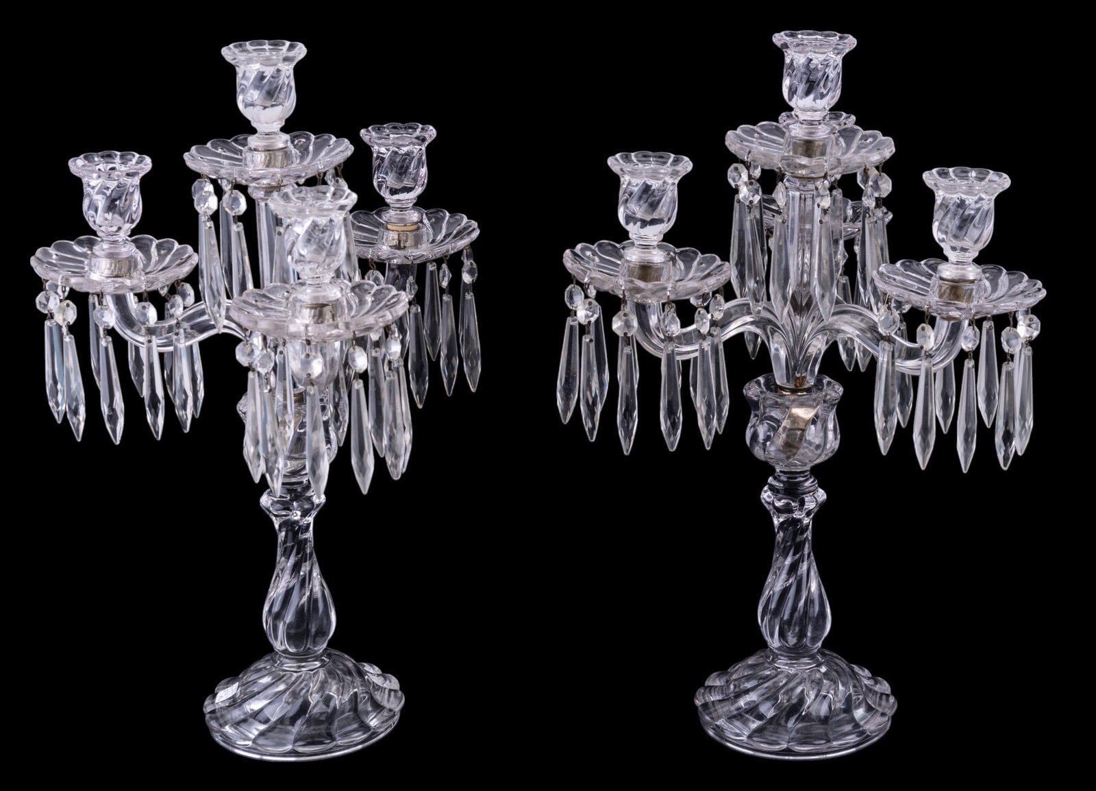 Pair of Elaborate Pressed Glass Candelabras: Pair of elaborate pressed glass candelabras approx. 19.5" tall w/ hanging crystals. Item is potentially missing crystal drops (not verified).