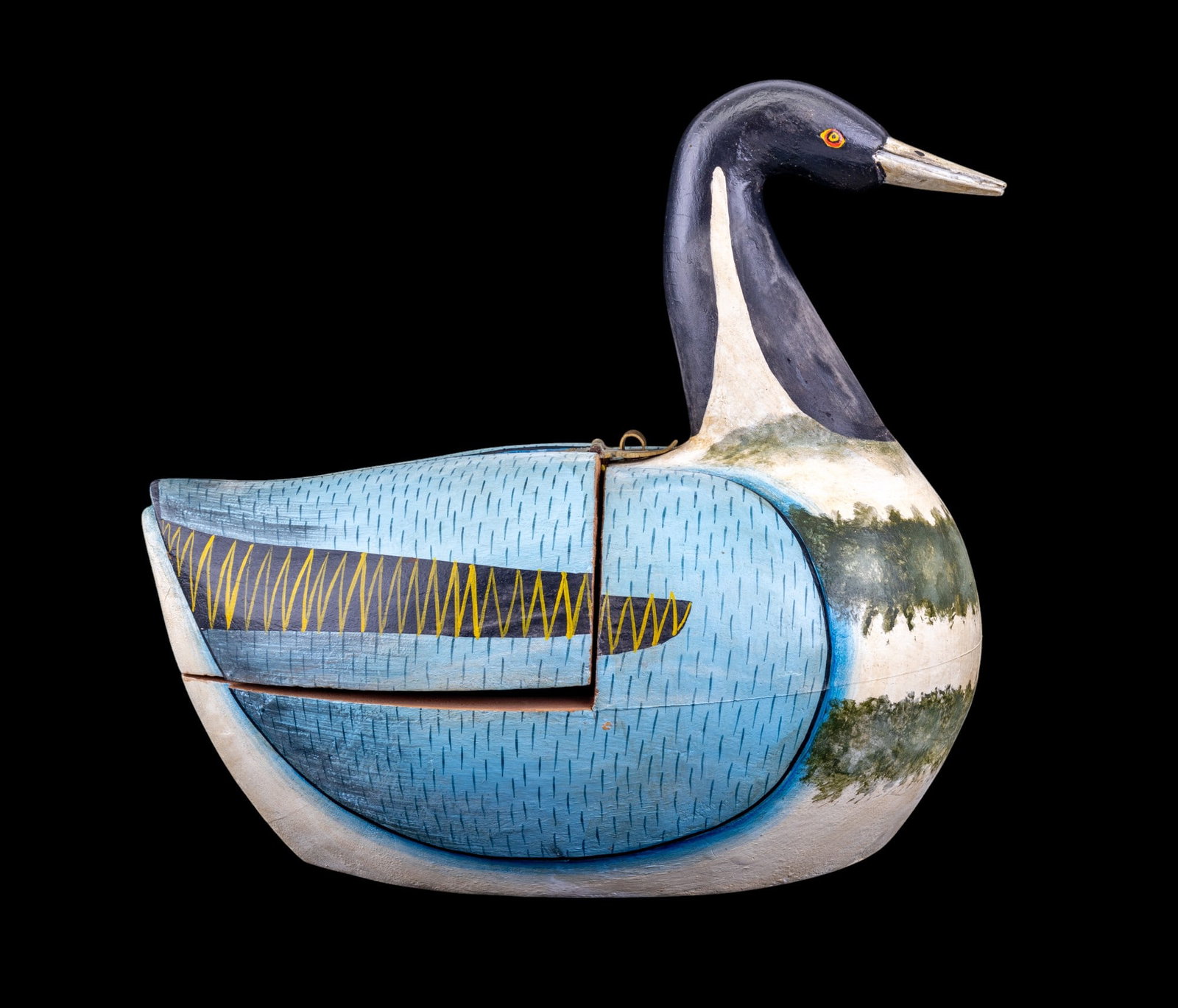 1st Half 20th C Goose Box: Early 20th C wooden goose box w/ light blue wings, painted eyes, & hatch that opens below the neck. Item measures approx. 11" tall, 8" wide, & 12" deep.