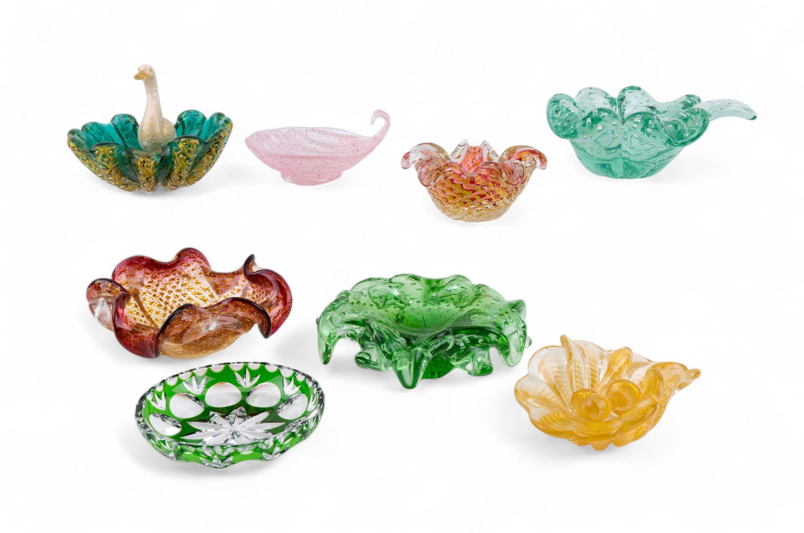 Murano Glass Nut / Candy Bowls (7) + Another: Collection of 7 Murano glass nut / candy bowls, one w/ duck figurine that measures approx. 5.5" tall, 6.5" wide, & 5" long. Another green & clear glass bowl is included.