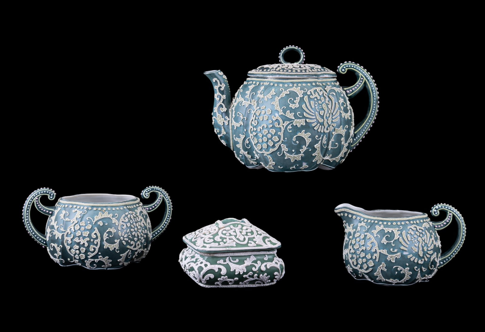 Japan Moriage Tea Service, Figurines, More: Japan Moriage green ceramic teapot, open sugar, creamer, & waste bowl in as found condition (broken w/ visible repairs), all signed on bottom w/ script mark. Teapot measures approx. 6" tall.