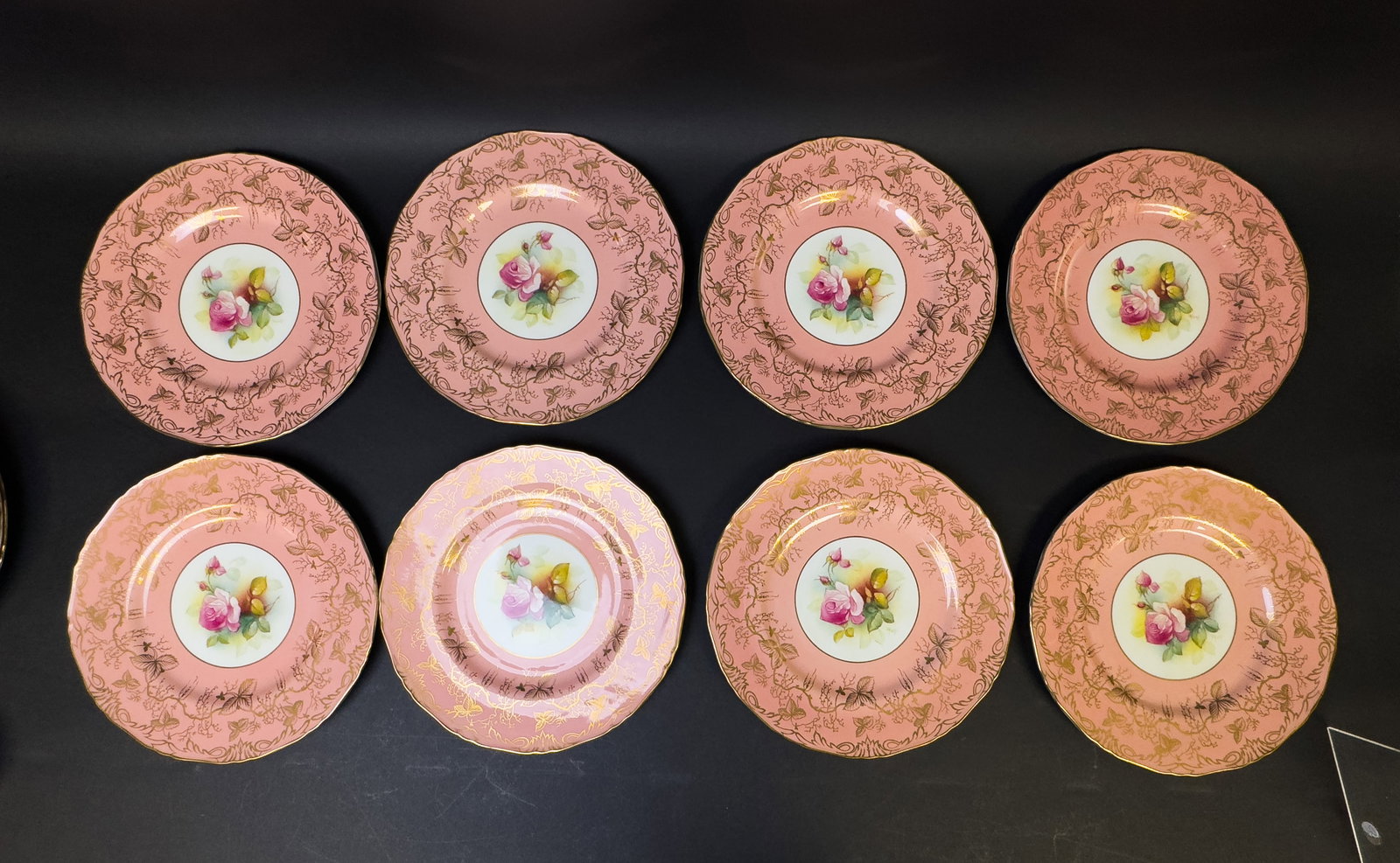 Royal Worchester Dinner Plates (12): 12 Royal Worchester dinner plates w/ pink & gold design & hand-painted floral center design. Plates are approx. 10.5" in diameter.