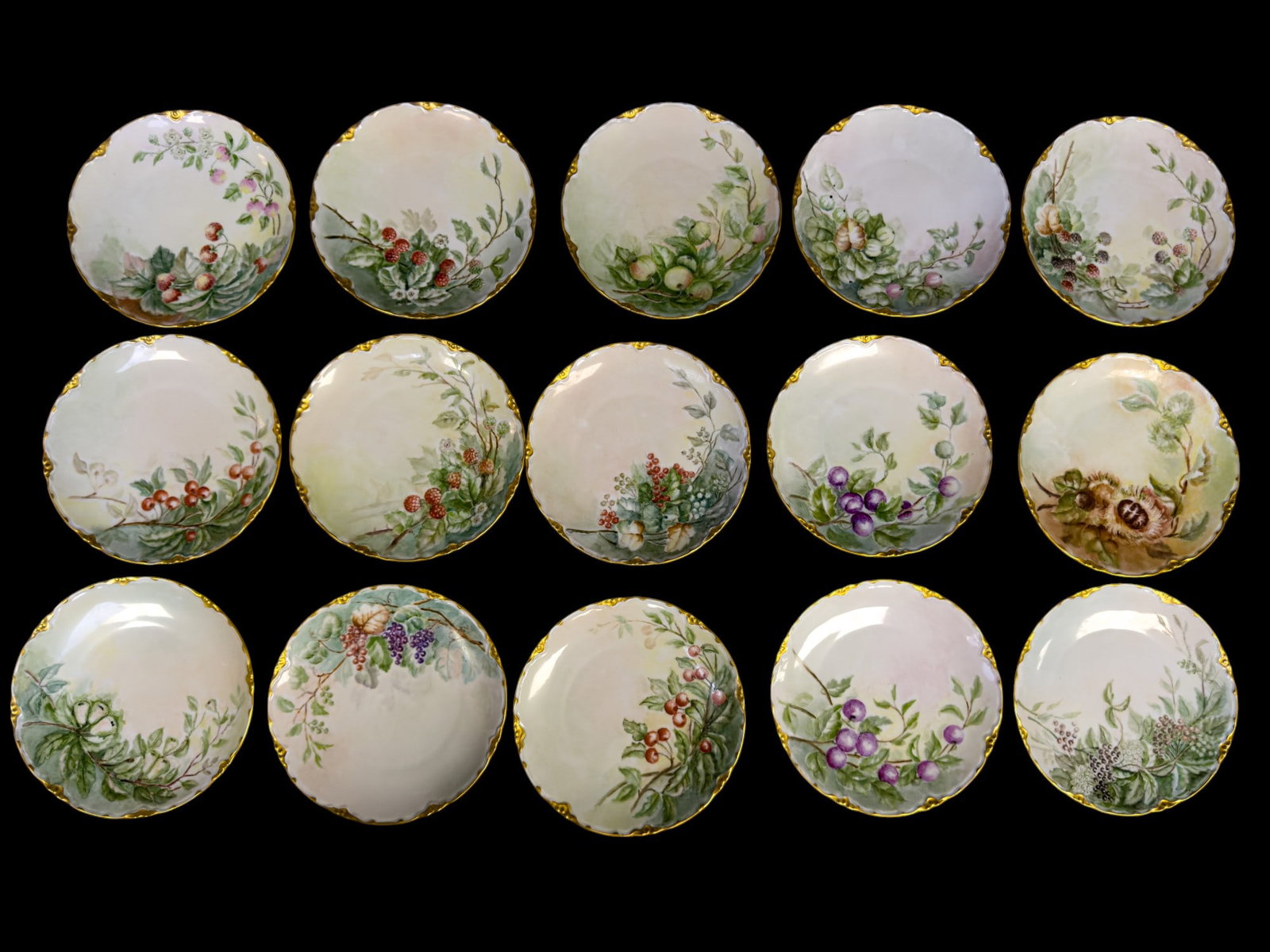 Bavarian Fruit Plates (15): 15 Bavarian plates w/ hand-painted fruit designs, marked 1930 PM (Crown) Bavaria. Plates measure approx. 7" in diameter.