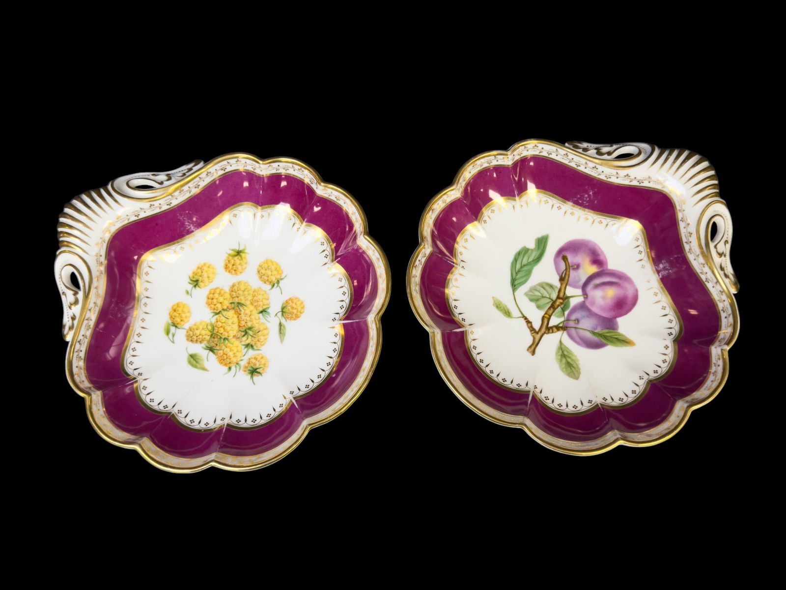 Antique Porcelain Shell Shaped Gilt Dishes (2): Rare 19th C porcelain shell shaped serving dishes / bowls w/ fruit designs - one golden raspberries, one plums, gold and purple coloring. They retain a Michael Davis sticker on bottom (Davis was a 20t