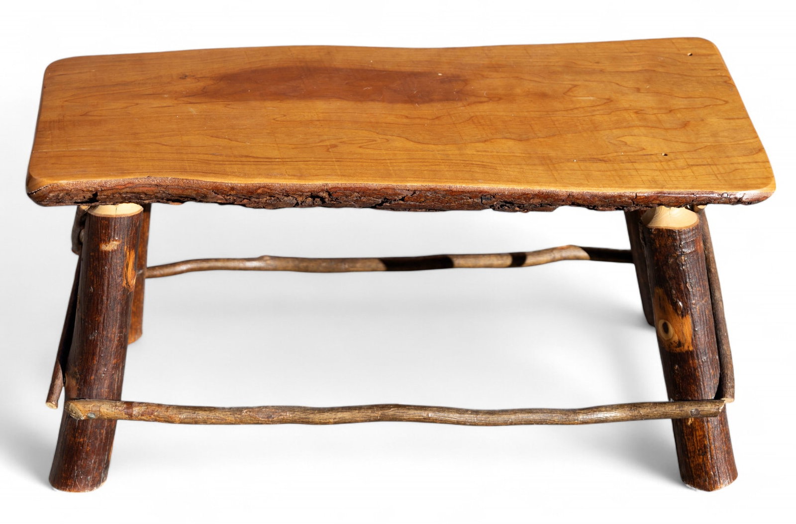 Live Edge, Adirondack Bench w/ Branch Legs: Rustic Adirondack style wood slab small bench / stool w/ branch legs. Item measures approx. 13" tall, 22" wide, & 11" deep.