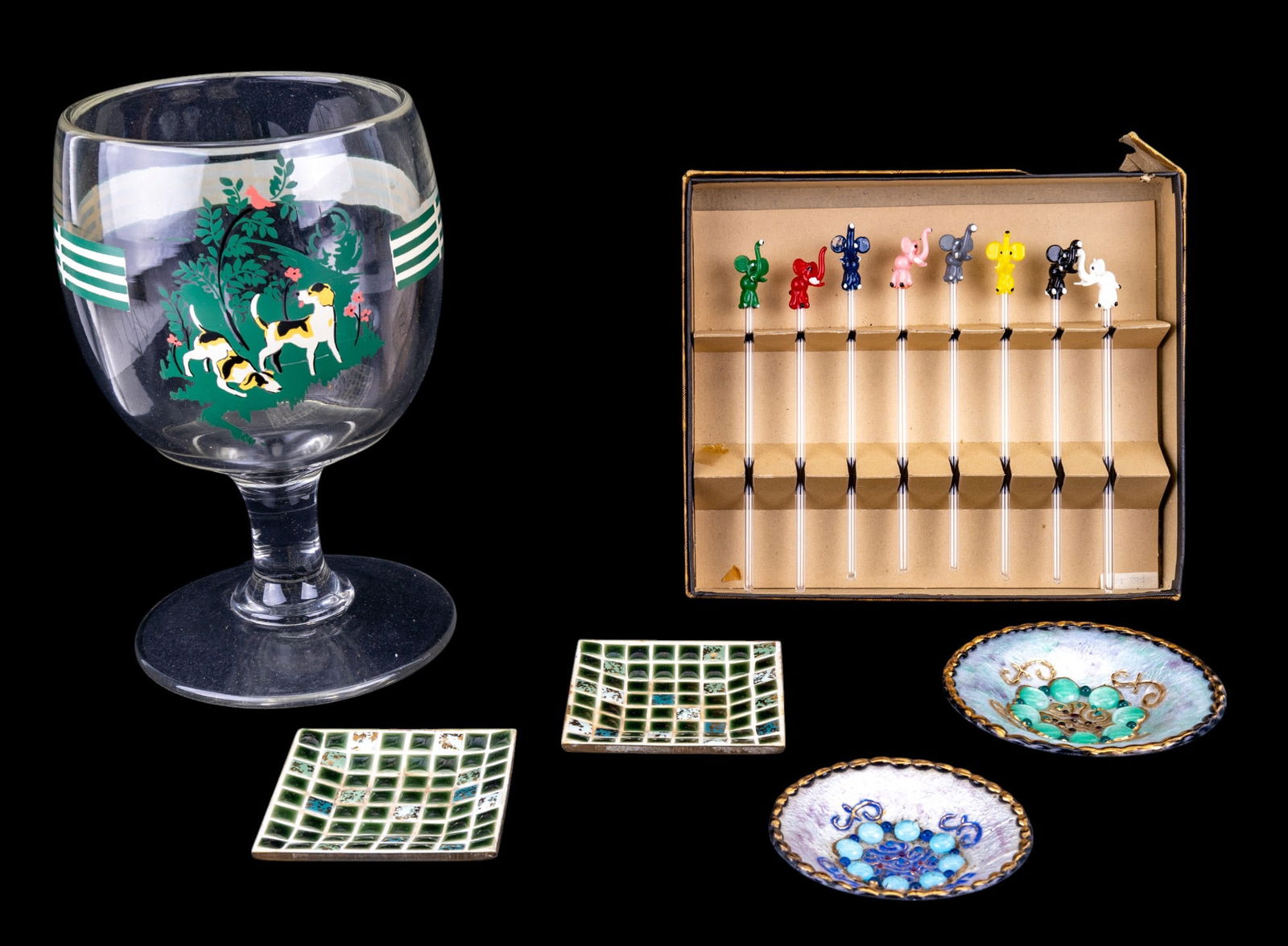 1950s Schooner Glass, Cocktail Stirrers, Ashtrays: Large 1950s era schooner glass w/ 2 hunting dogs & green & white stripe design, hand-blown glass cocktail stirrer set w/ figural elephants (8), 2 1950s era green tile ashtrays, & 2 early French enamel