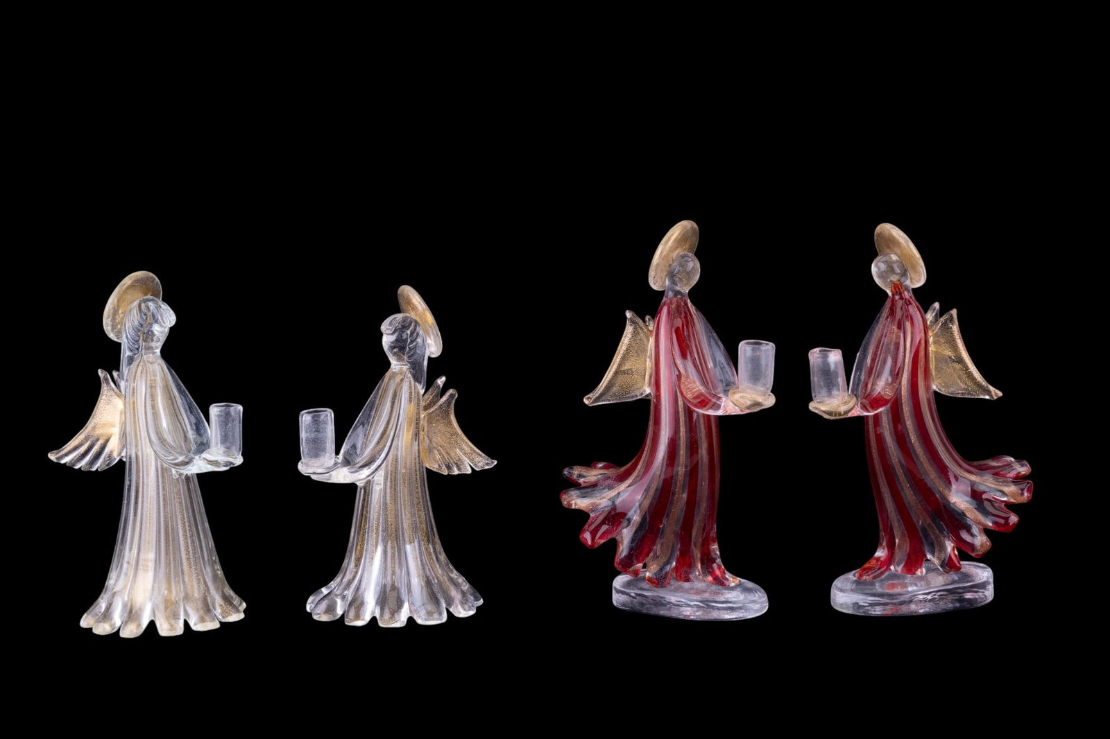 2 Pairs of Murano Glass Angel Candlestick Holders: 2 pairs of Murano glass angel candlestick holders, 1 w/ red stripes. Both pairs have a touch of gold. Items measure approx. 9" tall.