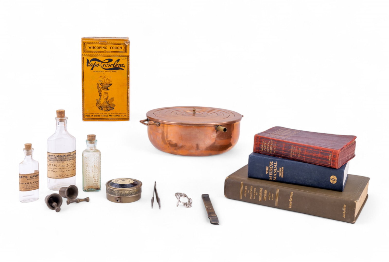 Vaporizer, Copper Water Bath, Medical Books: Vintage copper water bath with graduated ring 8", late 19th C Vapo Cresolene medicinal vaporizer, Quick Loader black power loader by American Can Co., three sets of tongs, The Merck Manual of Diagnosi
