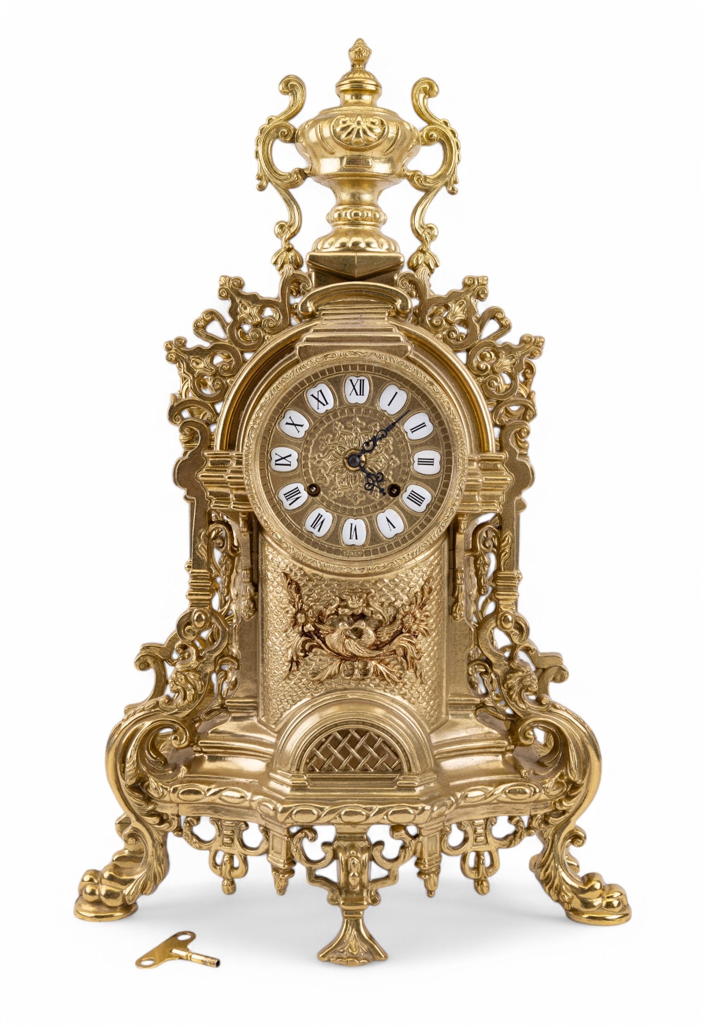 Vintage Italian Style Brass Mantle Clock: An Italian style vintage brass mantle clock thought to be after Franz Hermle. Piece measures approx. 22.5" tall, 14.5" wide, and 6.5" deep at deepest point. Clock has brass finial at top and a relief