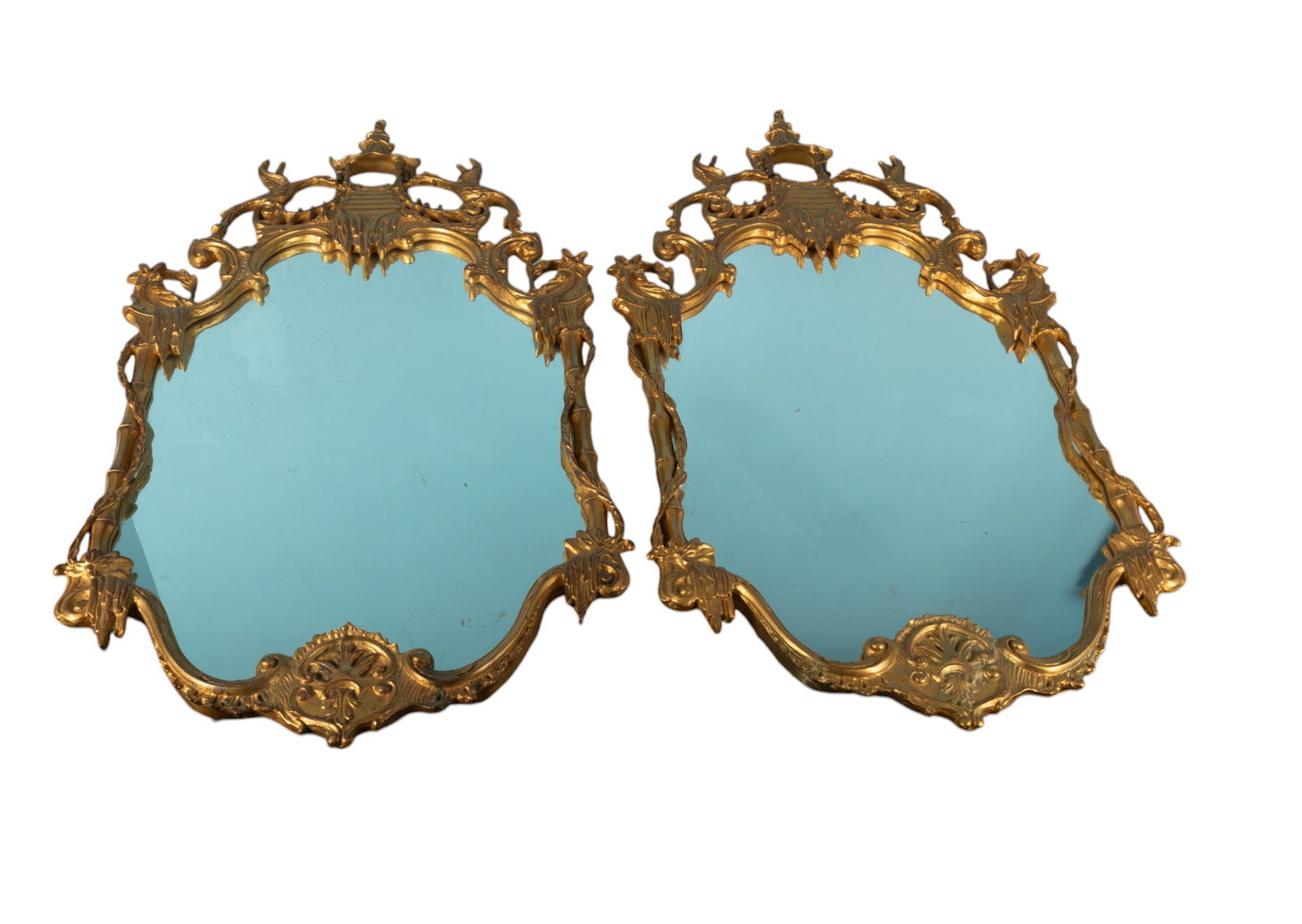 French Style Large Giltwood Mirror Pair (2 Pc.): Two French style giltwood carved mirrors measuring approx. 49"h x 26"w (whole piece) each. Mirrors in very good condition.