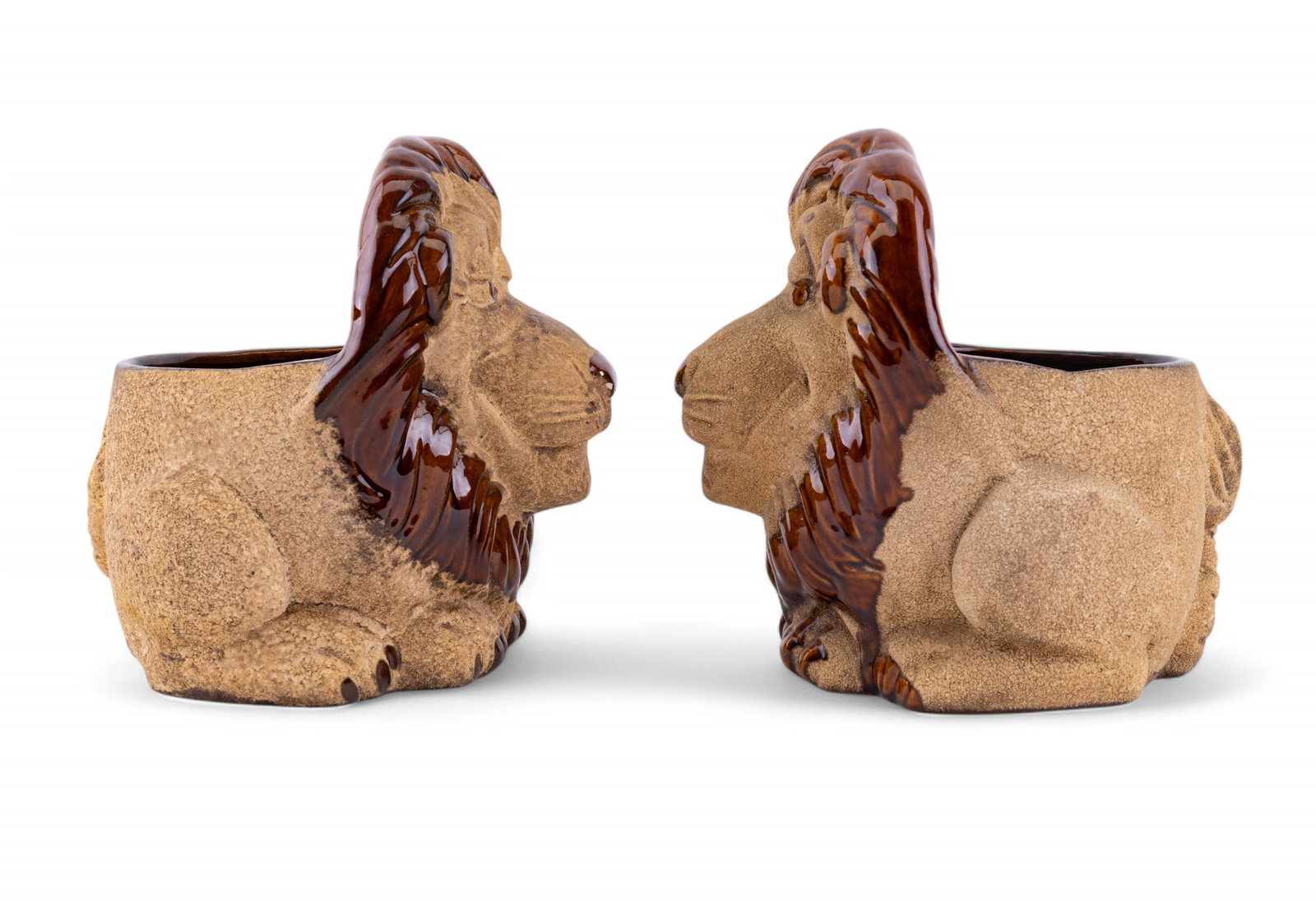 Royal Haeger Pottery Lion Planters (2): 2 matching Royal Haeger pottery lion planters measuring approx. 8.25" H x 7.25" W x 8.5" D. One lion has some loss on nose (see photos).