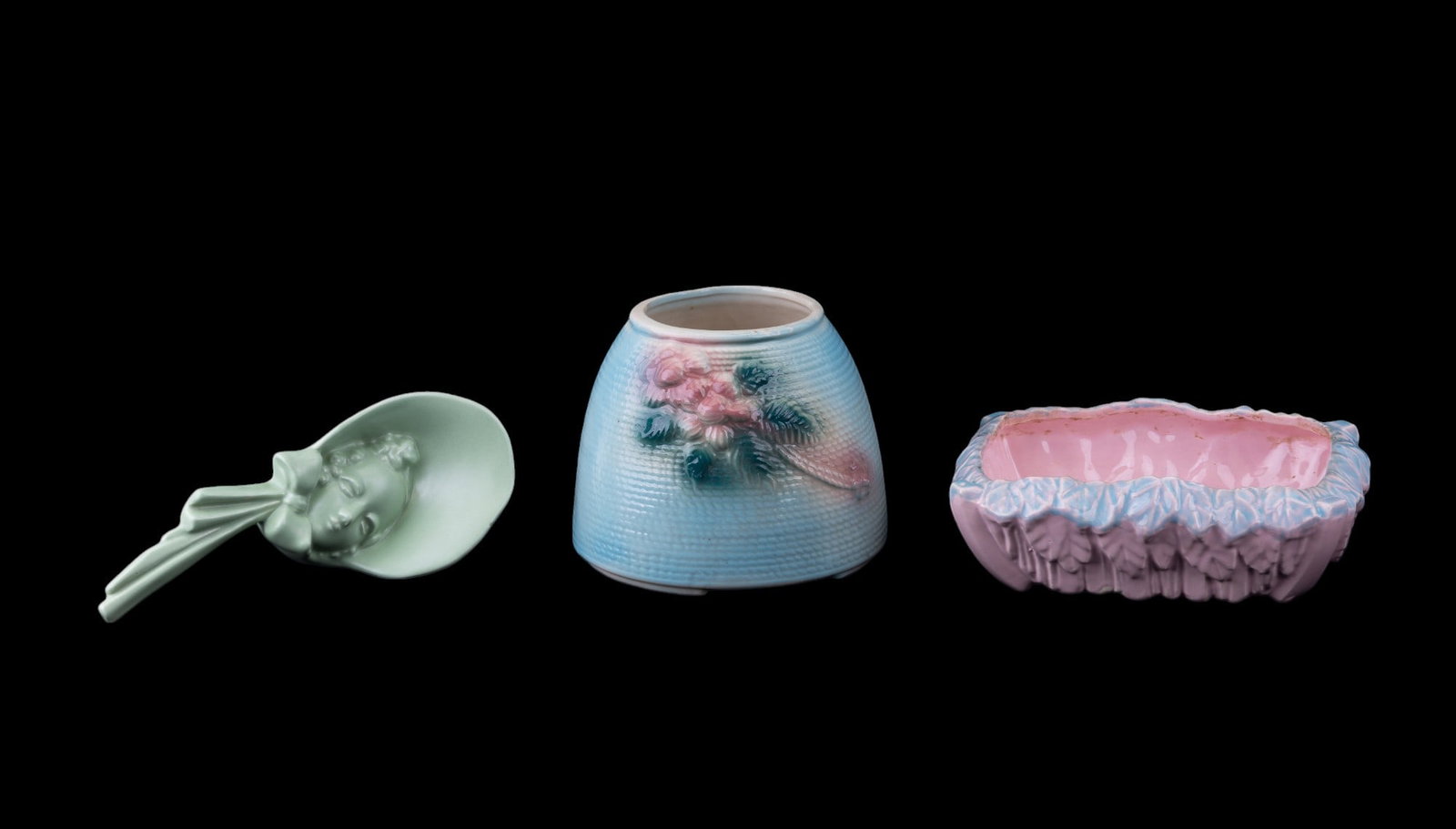 Royal Haeger, McCoy, and American Bisque Ceramics: Pink and blue pastel rectangular McCoy dish with floral motif measuring approx. 3" H x 9.25" L x 8" W, green Royal Haeger lady's bust wall vase, and bottom section of an American Bisque Dutch girl coo